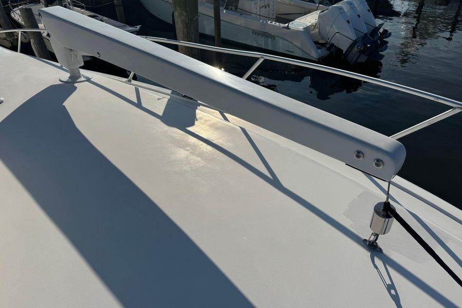 2002 Viking 61 Enclosed Bridge yacht deck with railing and davit system.
