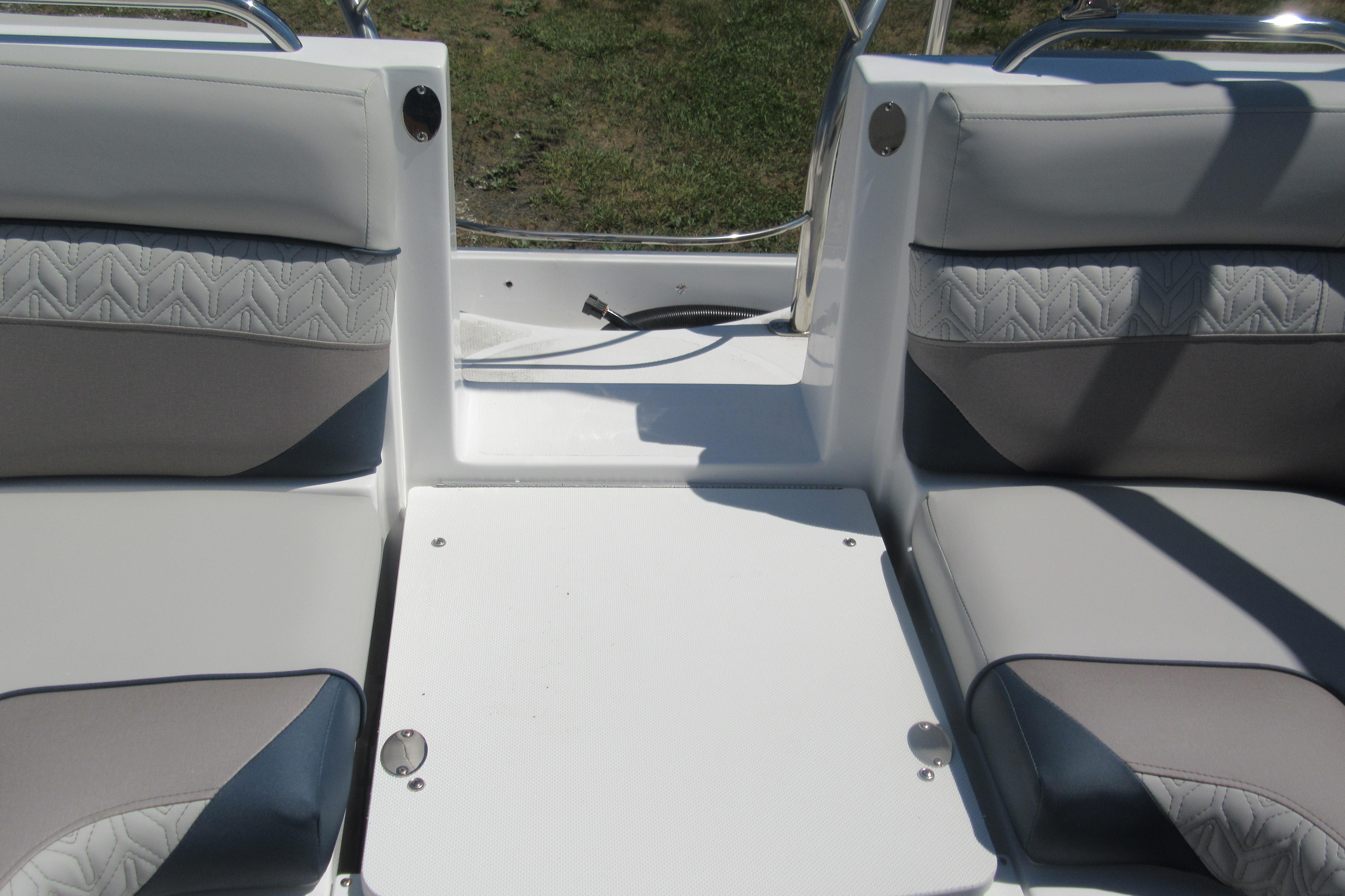 Interior seating of 2027 Hurricane SunDeck 2486 OB boat, featuring gray cushioned seats.