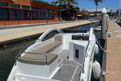 2024 Bracewell 25 boat docked at a marina with modern design and spacious seating.