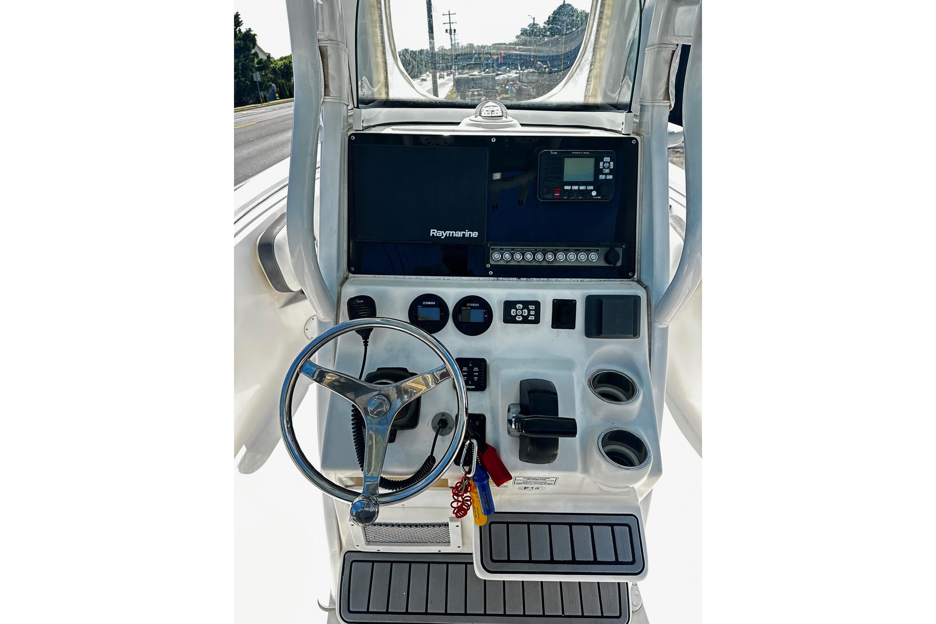 2020 Tidewater 230 CC Adventure boat console with steering wheel and navigation controls.