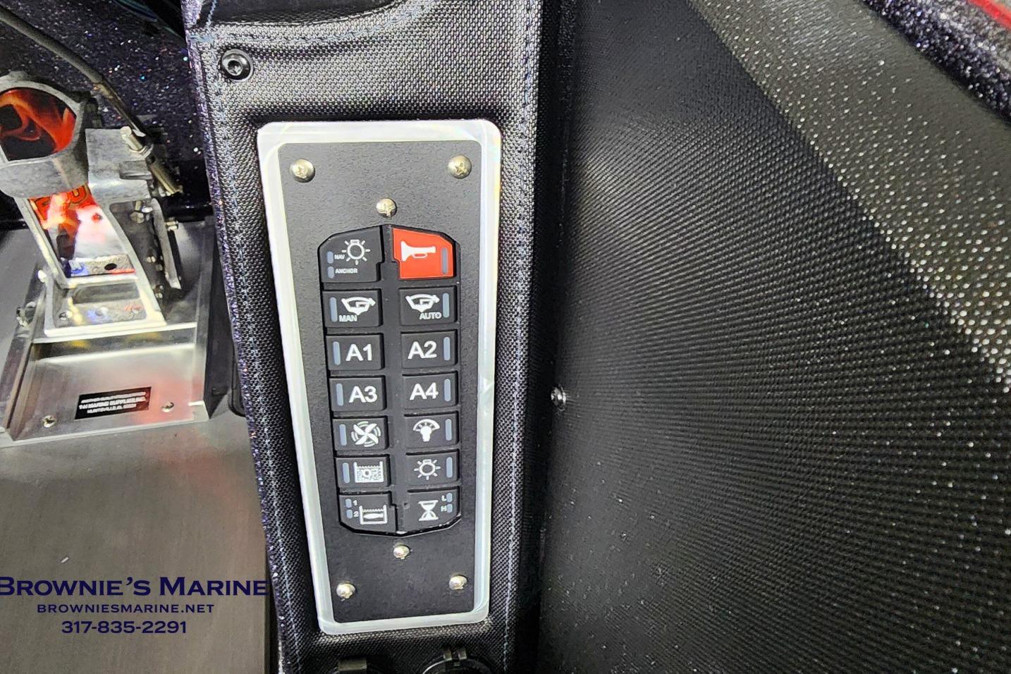 Control panel of 2026 Ranger Z521 boat with various function buttons.
