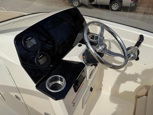 2025 Scout 215 Dorado boat dashboard with steering wheel and gauges.