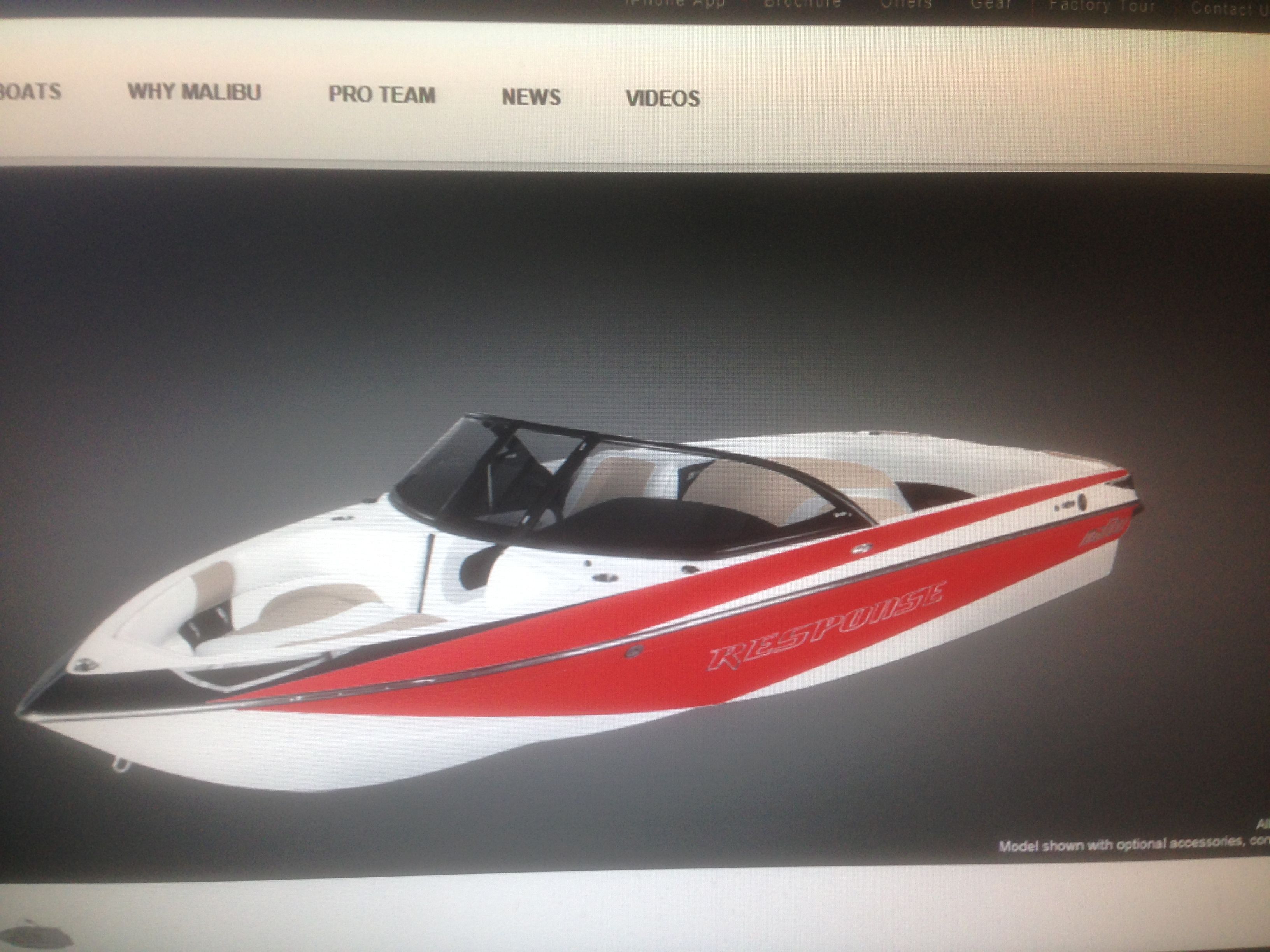 2014 Malibu Response TXi boat in red and white.