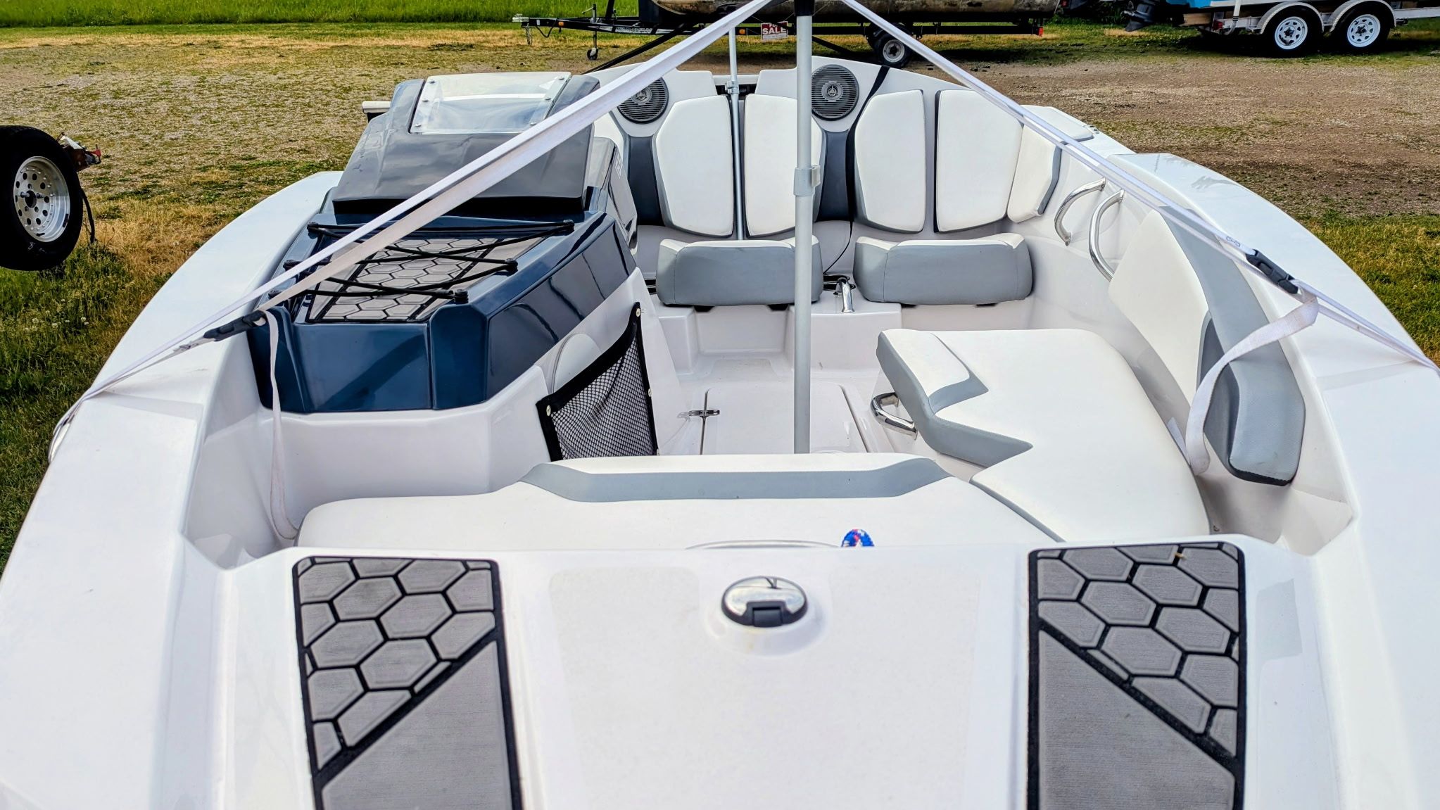 Interior of a 2017 Scarab 165 H.O. boat, white and gray.