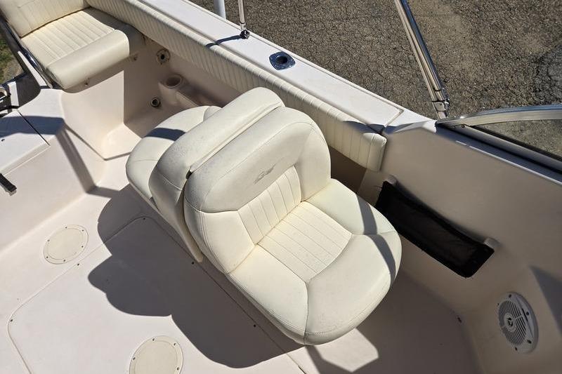 2007 Grady-White Tournament 205 boat interior with white seating and cup holders.