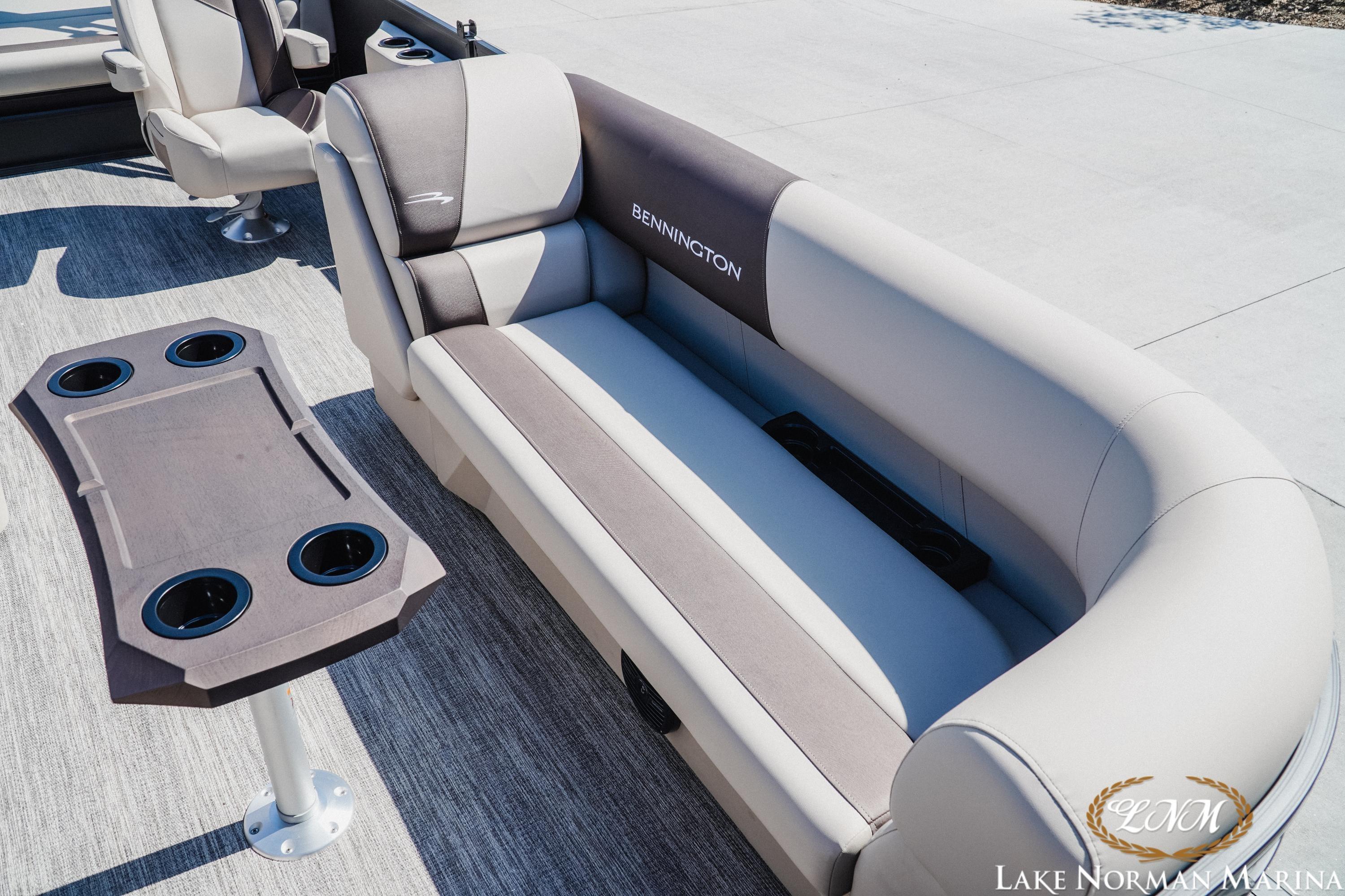 2027 Bennington 23SSB pontoon boat interior with plush seating and cup holders.