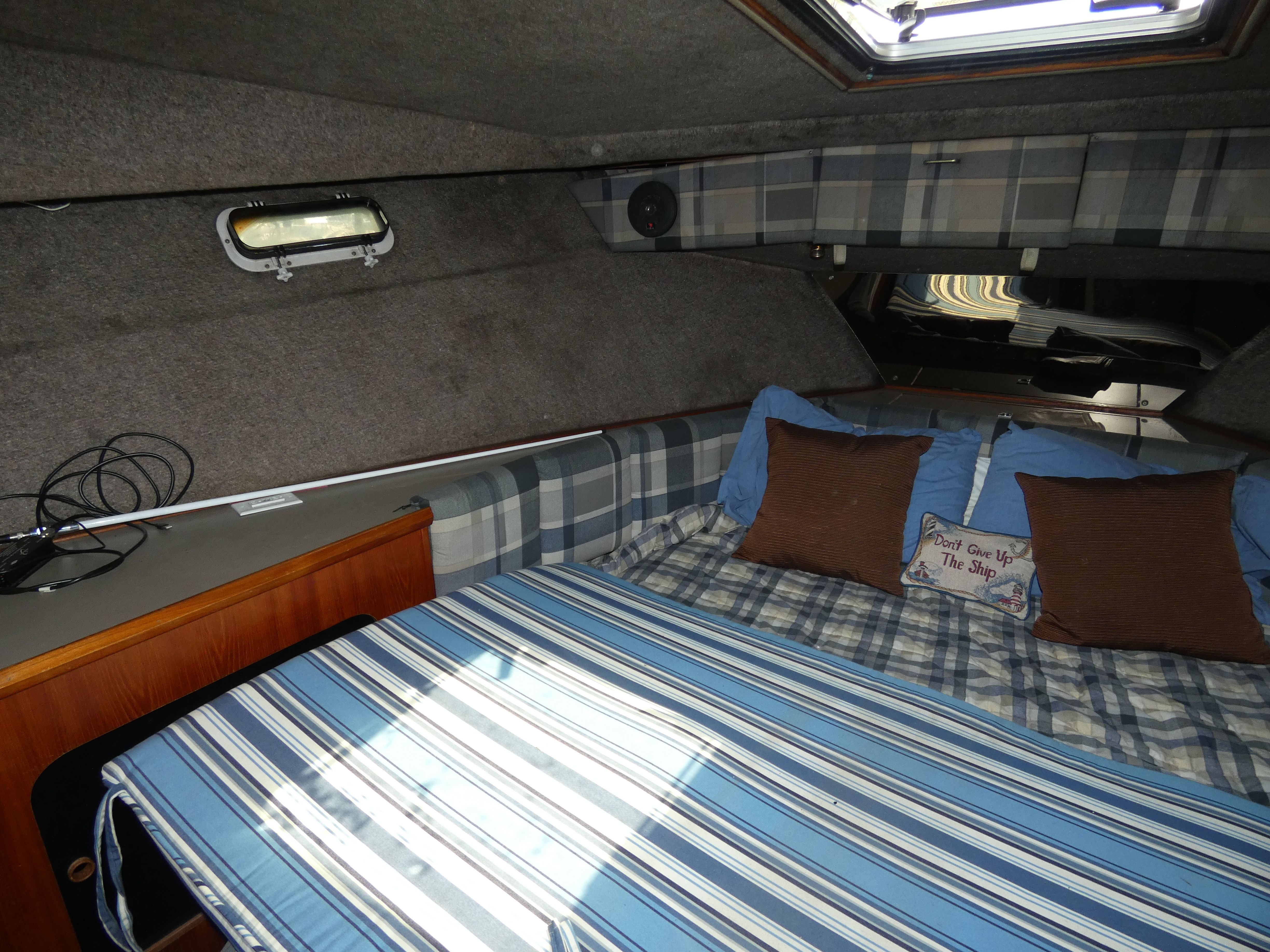 Interior of 1984 Bayliner 3870 Motoryacht featuring cozy sleeping area.