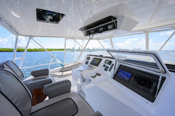 Helm of 2000 Viking 50 Convertible yacht with modern navigation equipment and ocean view.