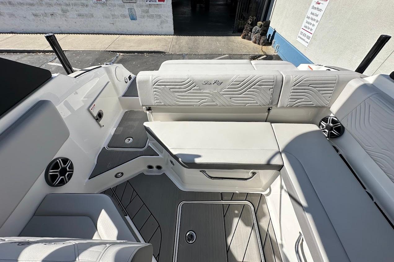2026 Sea Ray SDX 230 Surf boat interior with white seating and modern design.