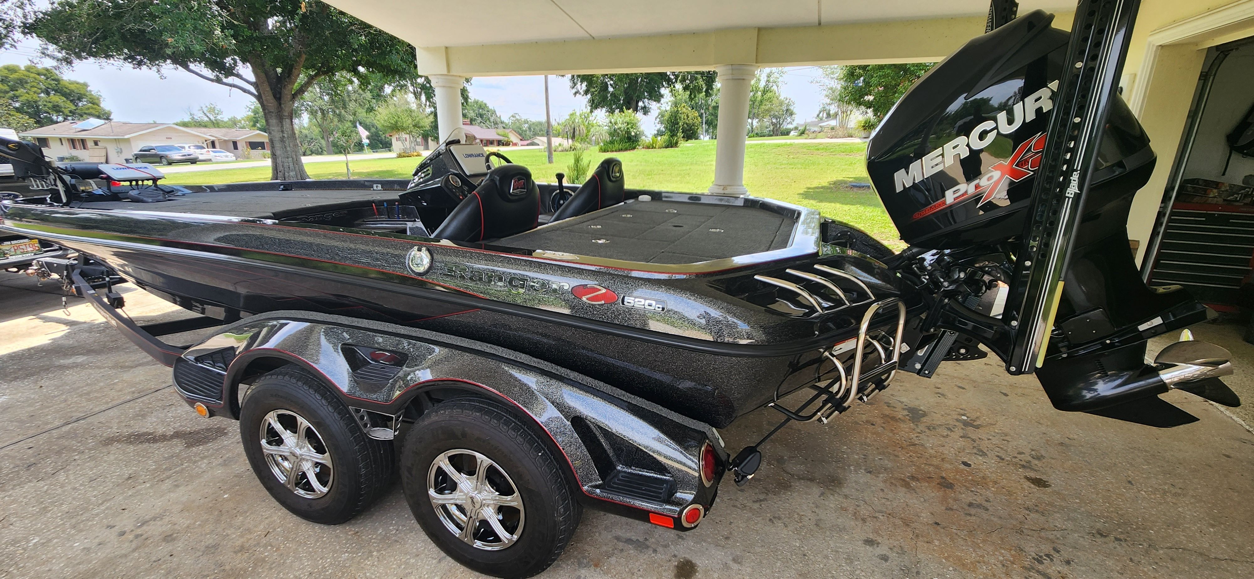 A 2017 Ranger Z520 Comanche boat on a trailer, featuring a Mercury Pro XS engine.