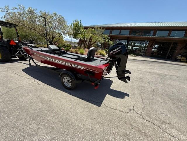 2025 Tracker Panfish 17 boat with Mercury engine on a trailer, parked outdoors.