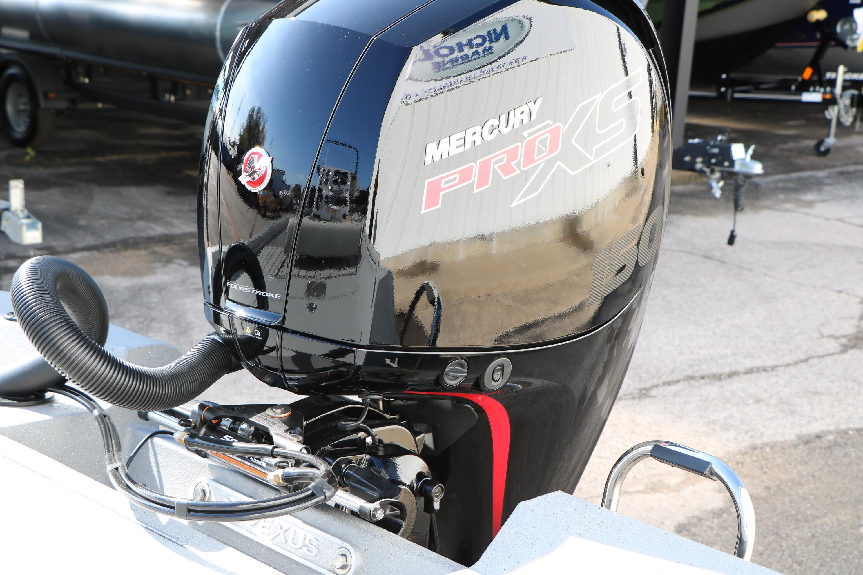 2026 Vexus ACX2000 with Mercury Pro XS outboard motor in a boatyard setting.