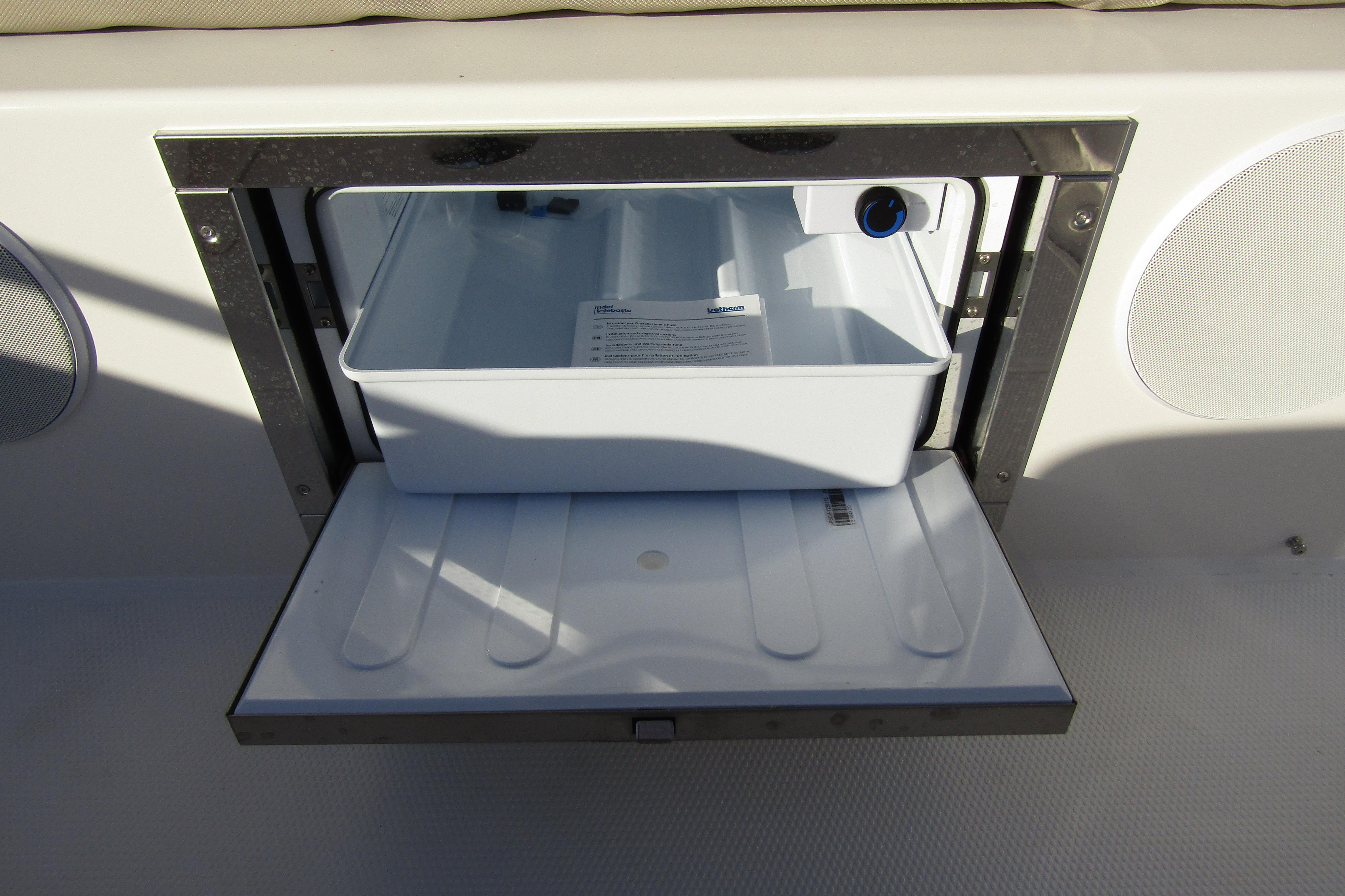 Built-in storage compartment on 2025 Nimbus Tender 9 boat.