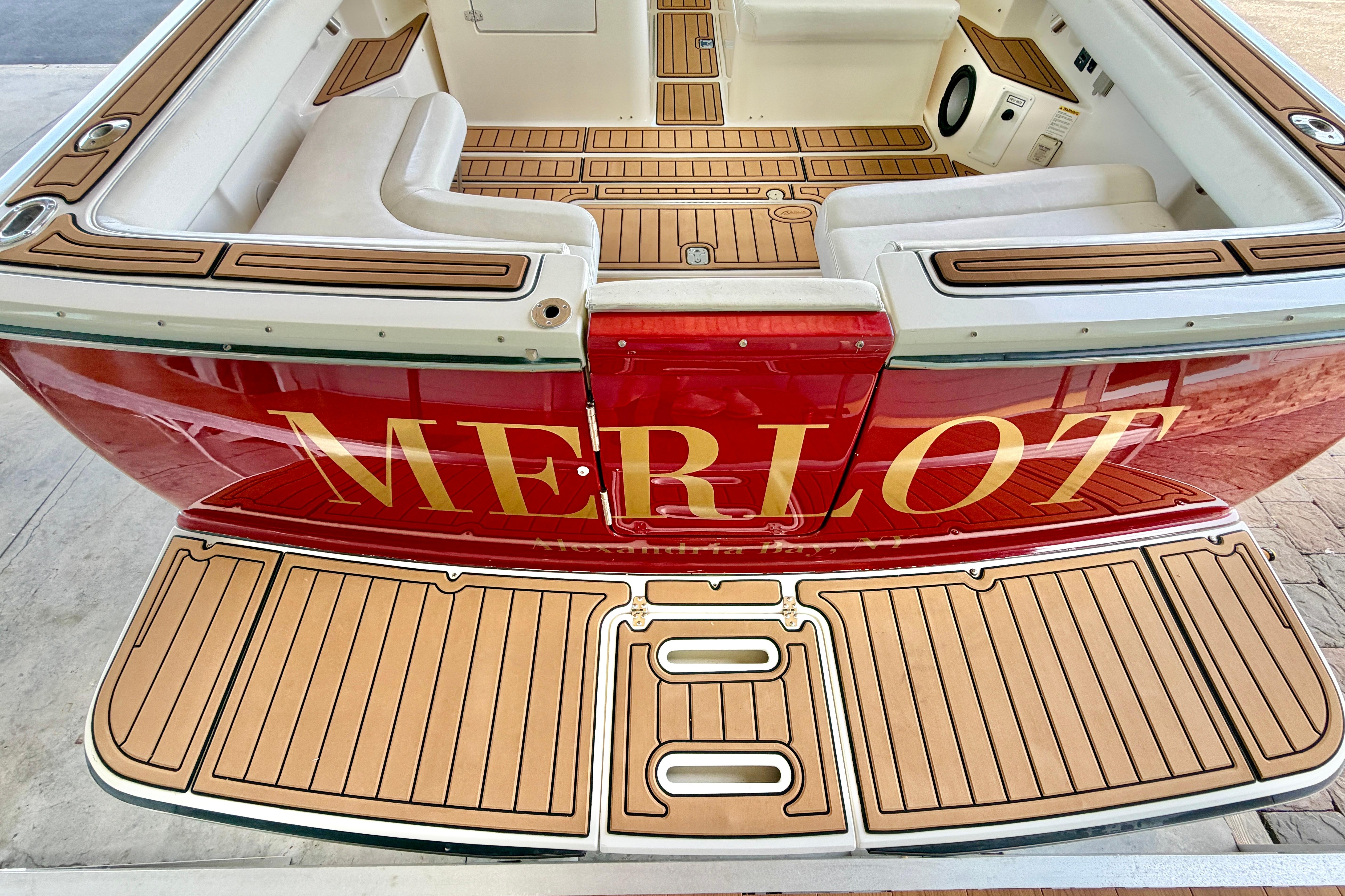 1999 Tiara Yachts 2900 Coronet with teak deck and "MERLOT" name on stern.