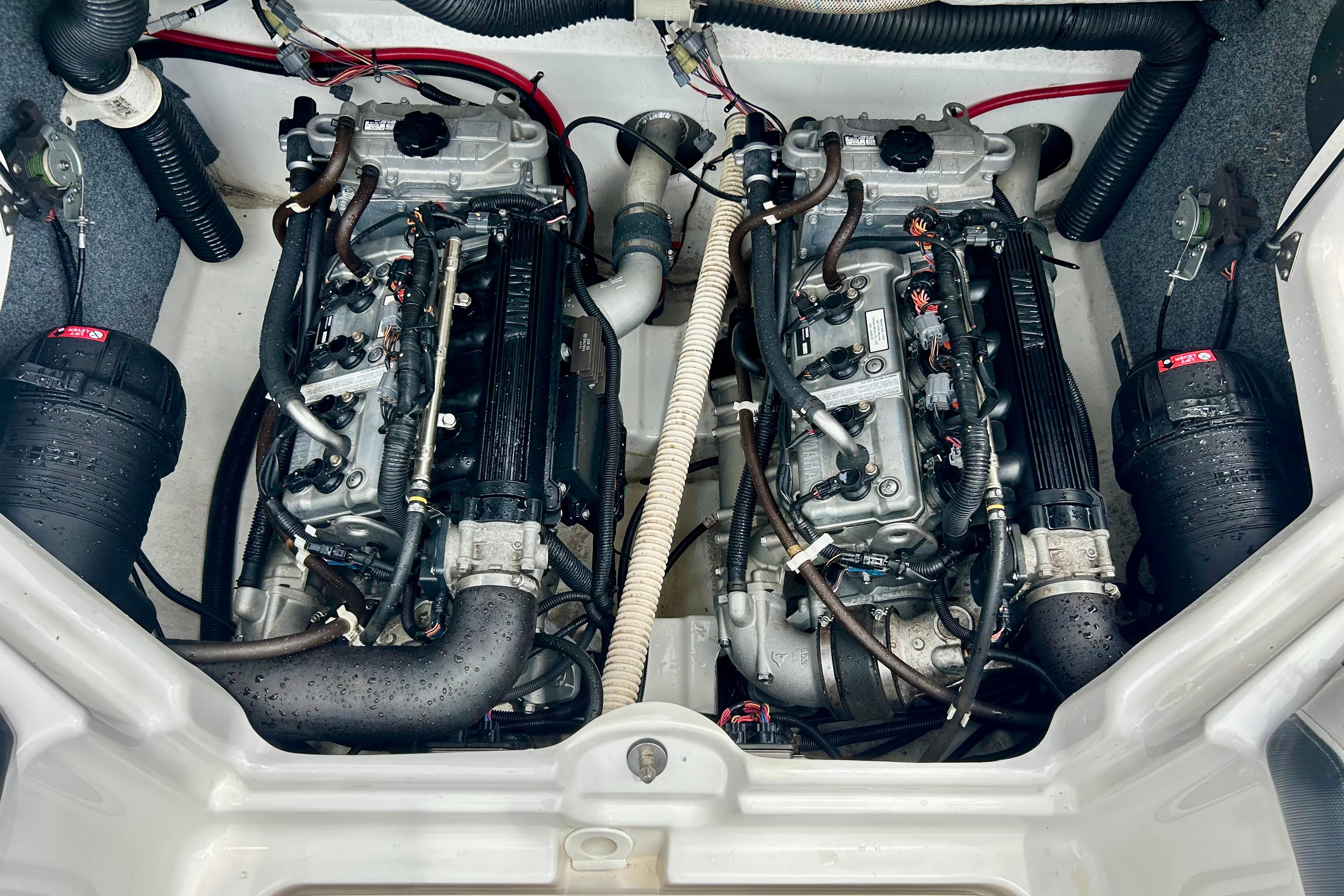 2015 Yamaha Boats AR210 engine compartment with dual engines and wiring.