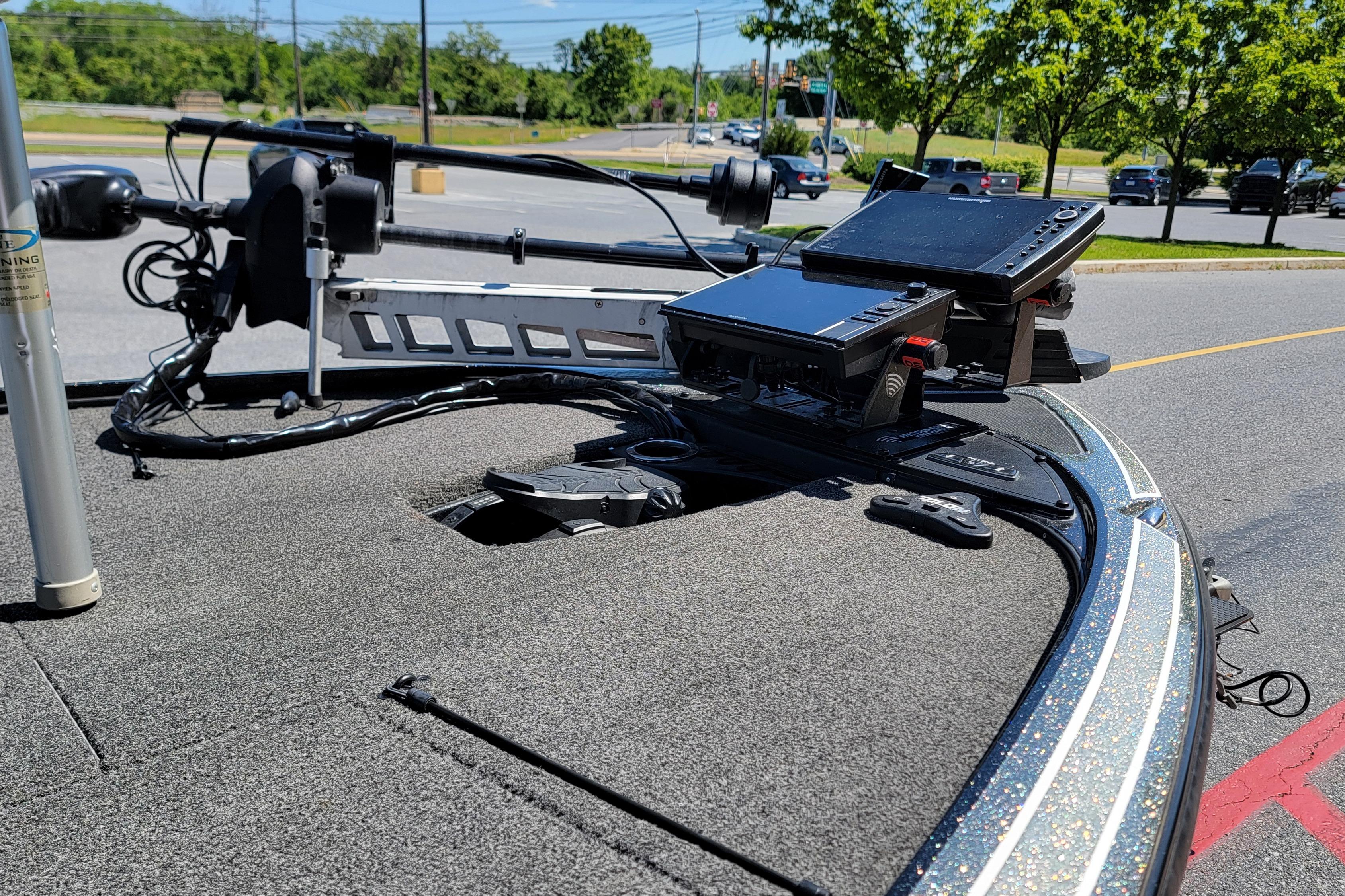 Fishing boat deck with electronic equipment, Nitro Z19 Pro, 2020 model, parked outdoors.
