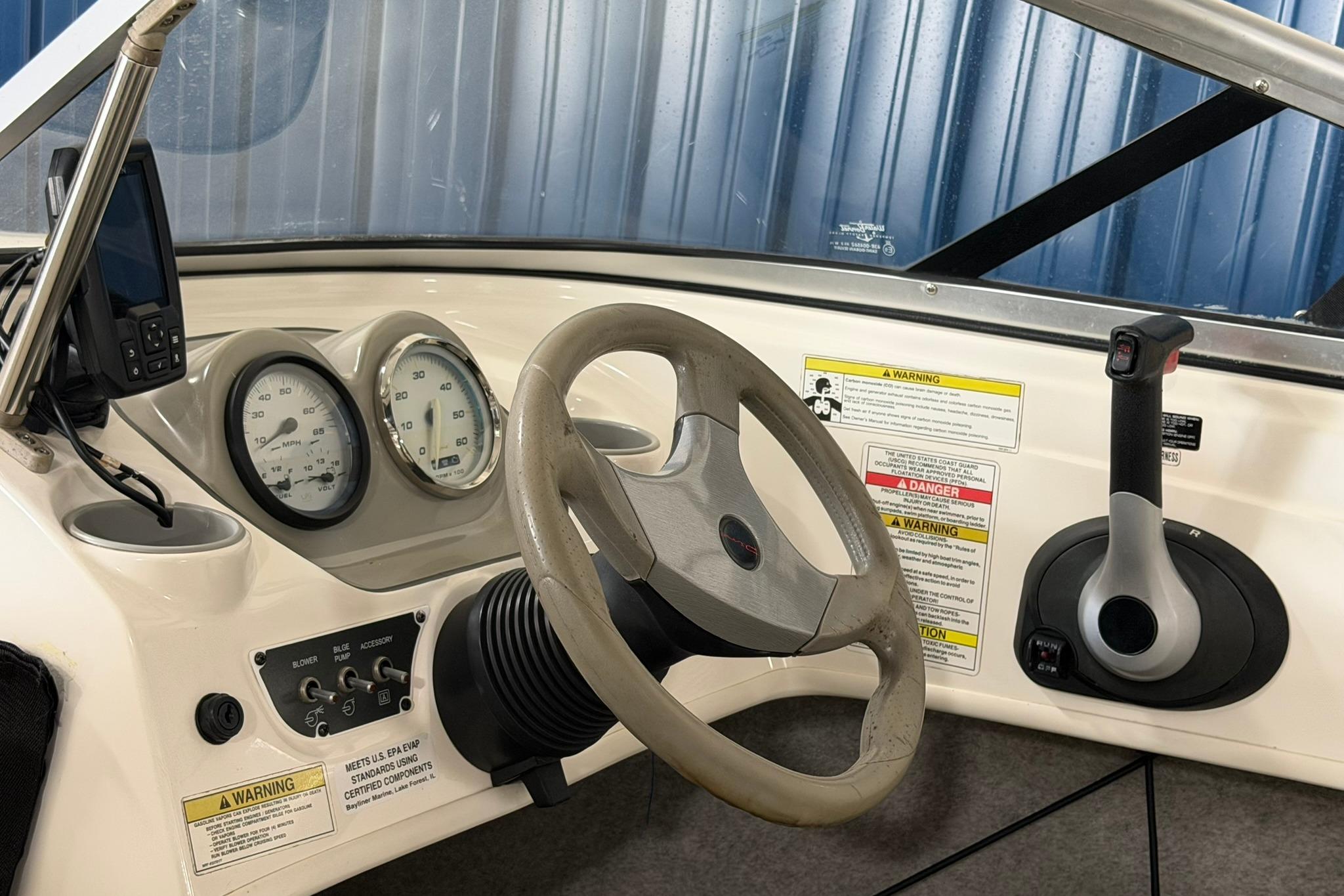 2012 Bayliner 175 Bowrider dashboard with steering wheel, gauges, and controls.