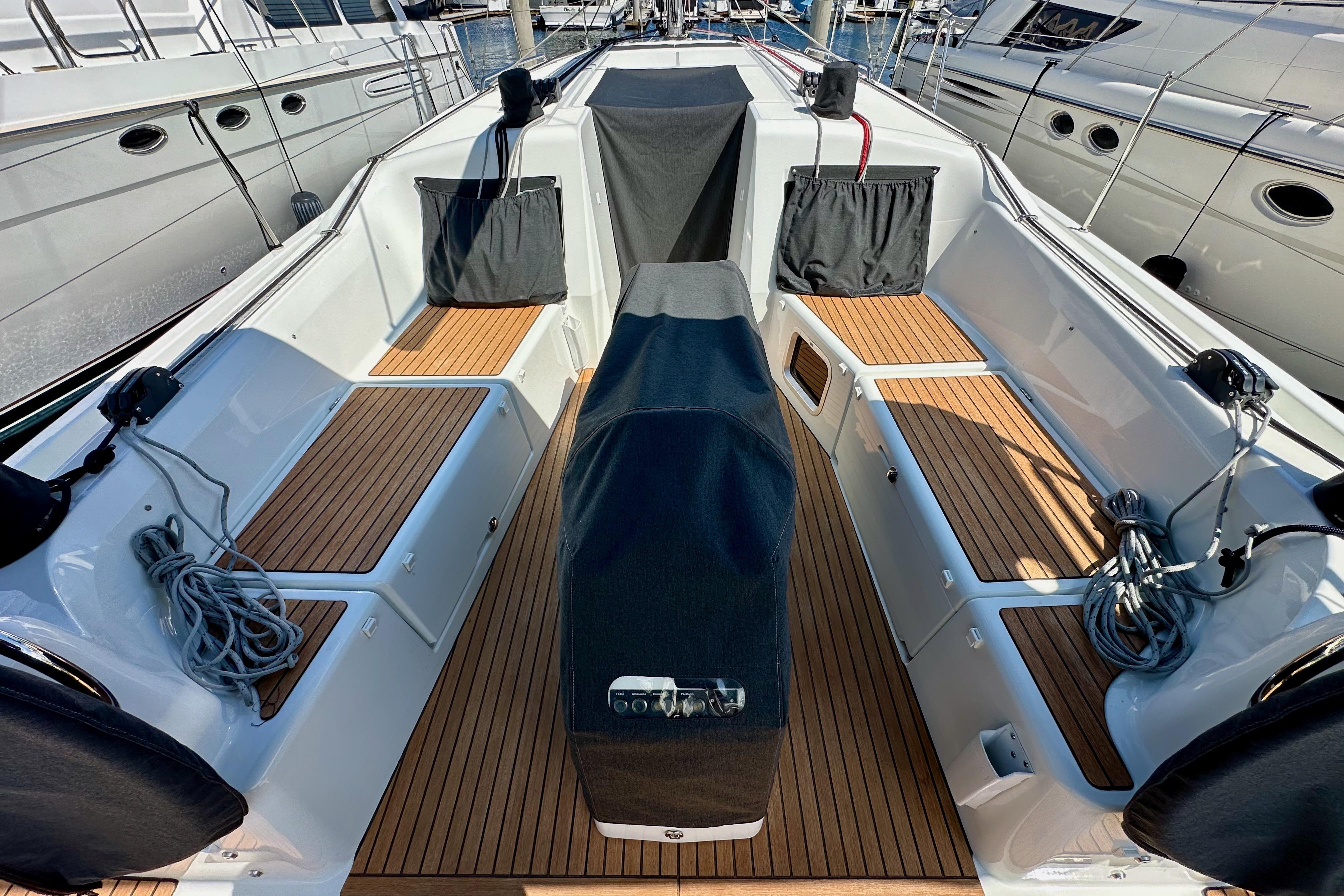2024 Jeanneau Sun Odyssey 410 cockpit with teak flooring and covered helm.