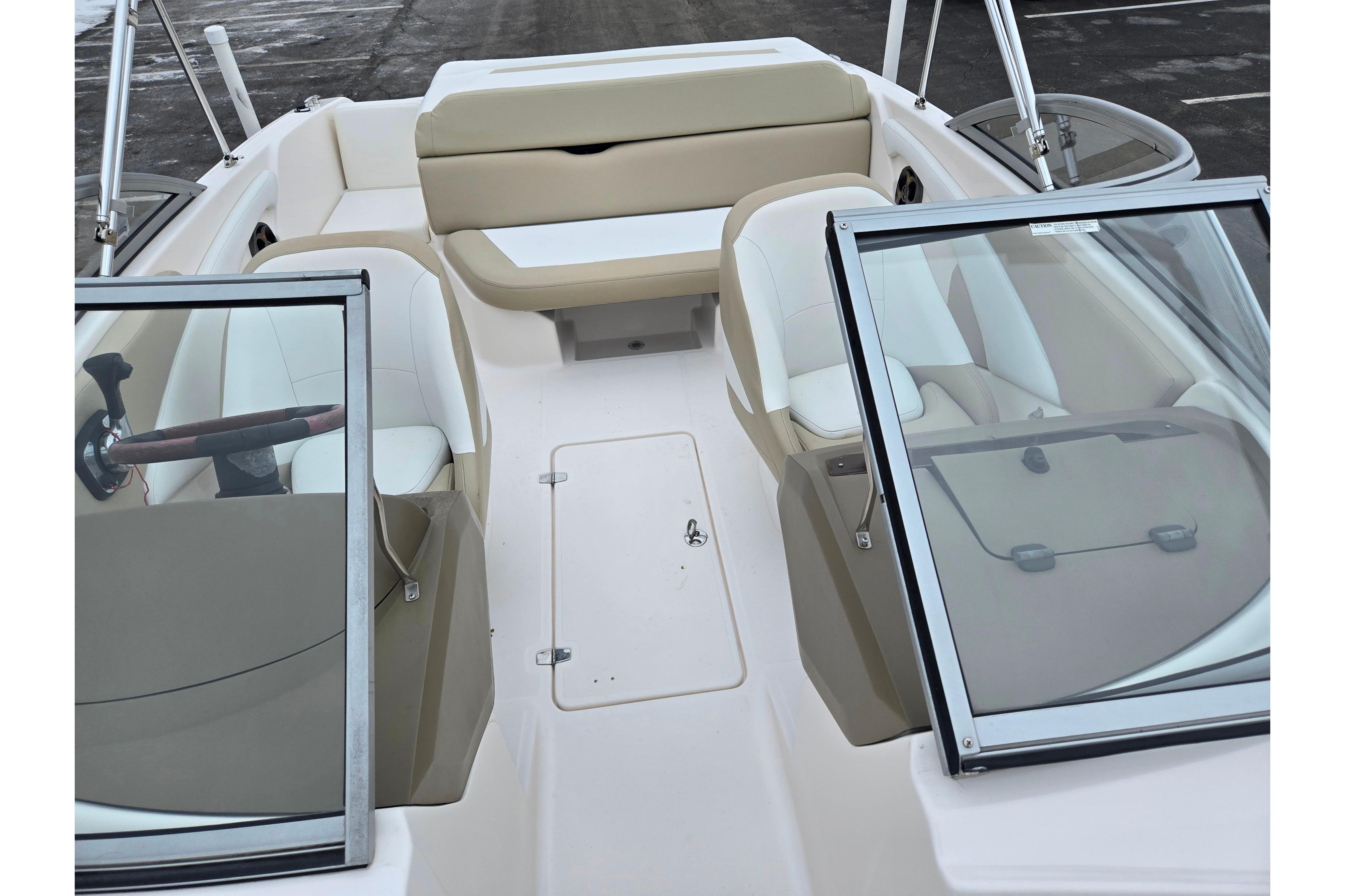2015 Regal 1900 ES Bowrider interior with beige and white seating, open windshield.
