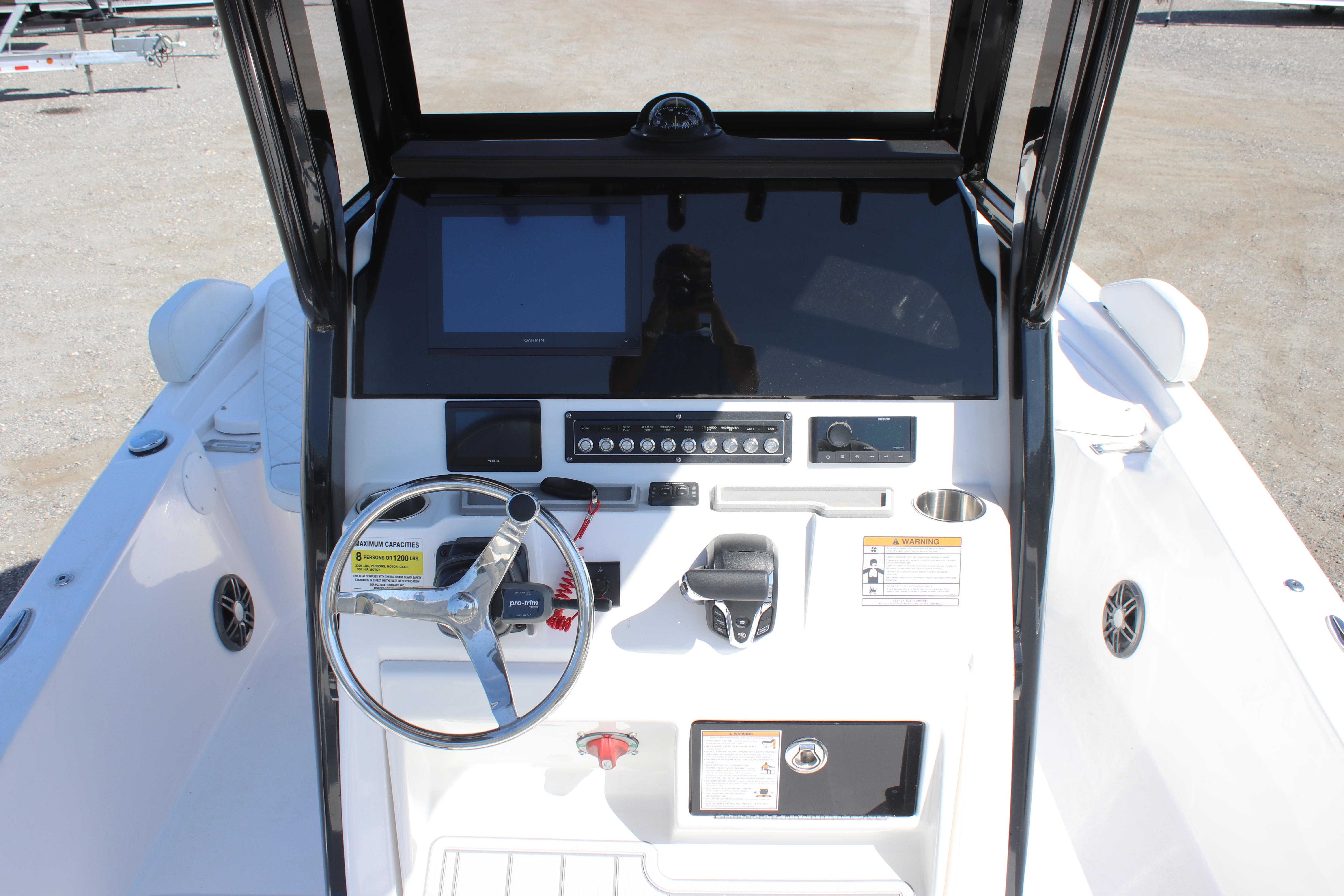 2025 Sea Fox 251 Bay Fox boat console with steering wheel and controls.