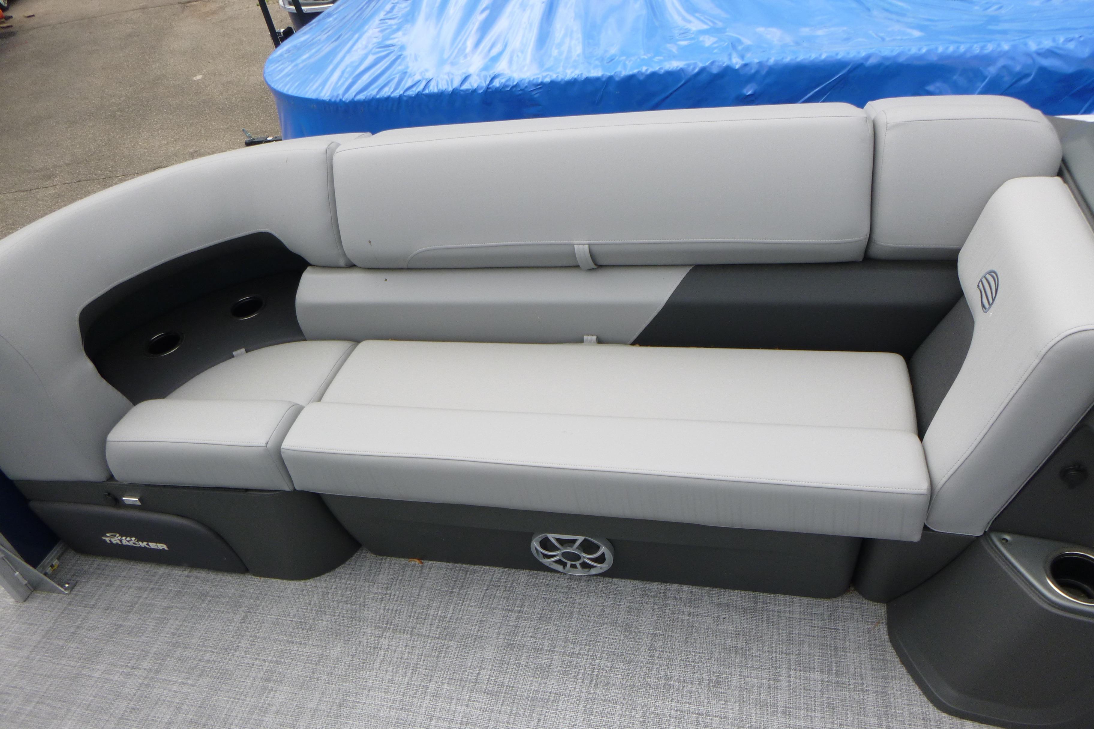 2026 Sun Tracker SportFish 22 DLX boat interior with gray cushioned seating.