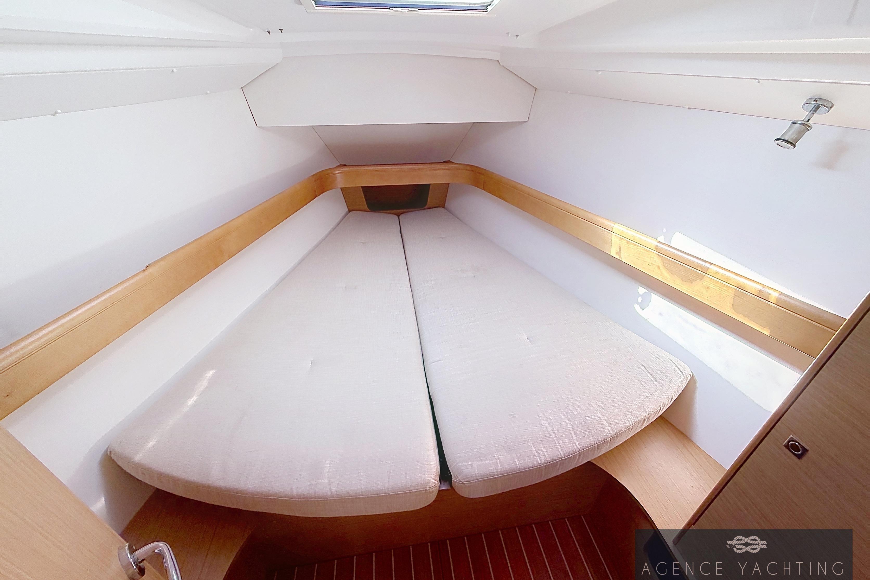 Interior cabin of 2009 Jeanneau Sun Odyssey 39i Performance yacht, featuring a cozy bed.