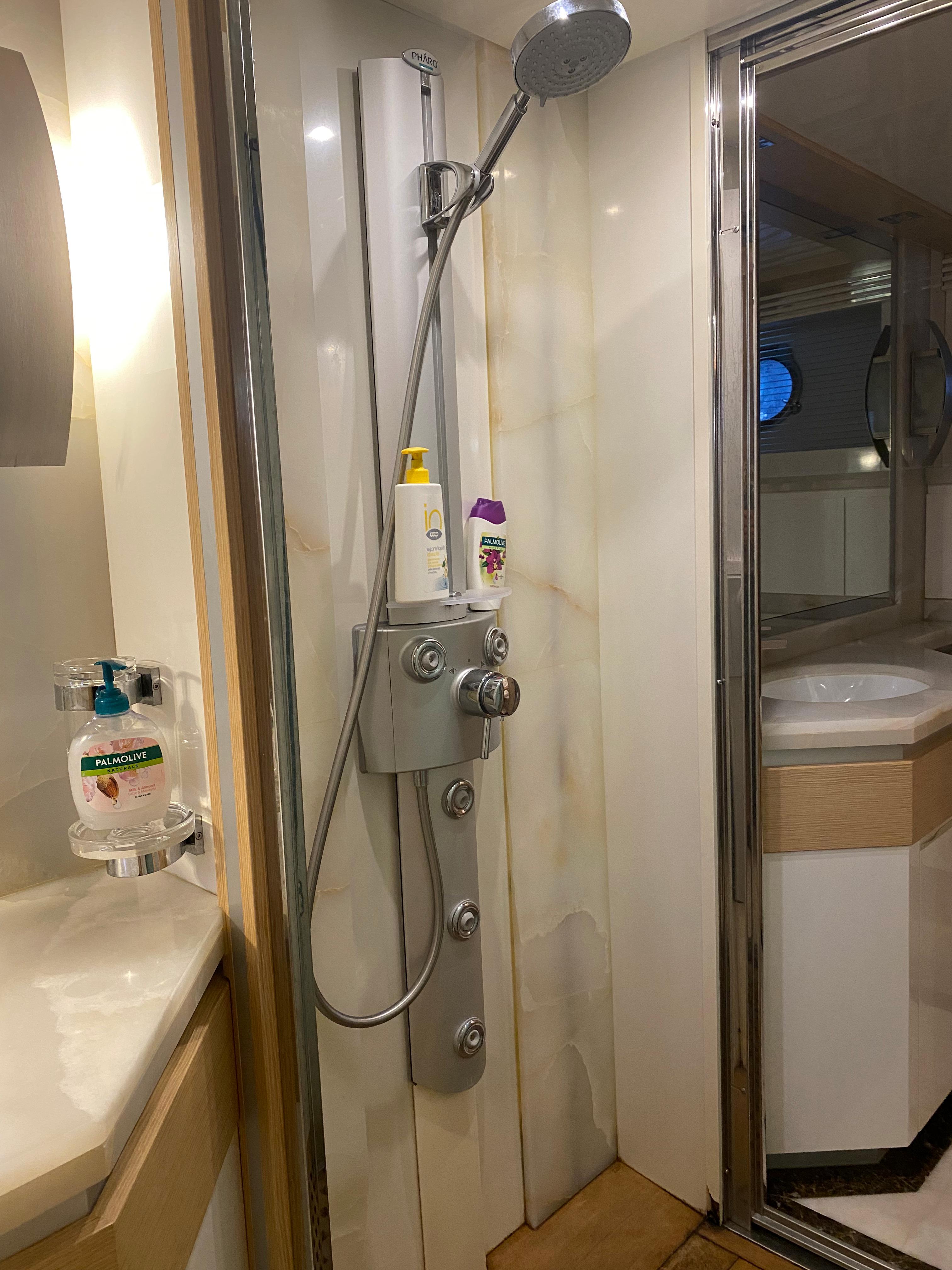 Luxurious bathroom in 2008 Dominator 680 yacht with modern shower and sleek fixtures.