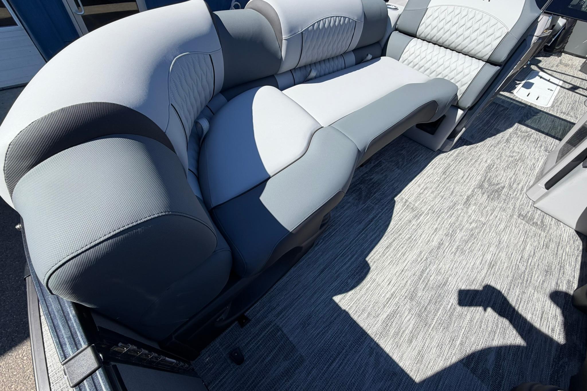 Luxurious seating in 2026 Avalon Excalibur LTD Quad Lounge boat, featuring elegant upholstery and spacious design.