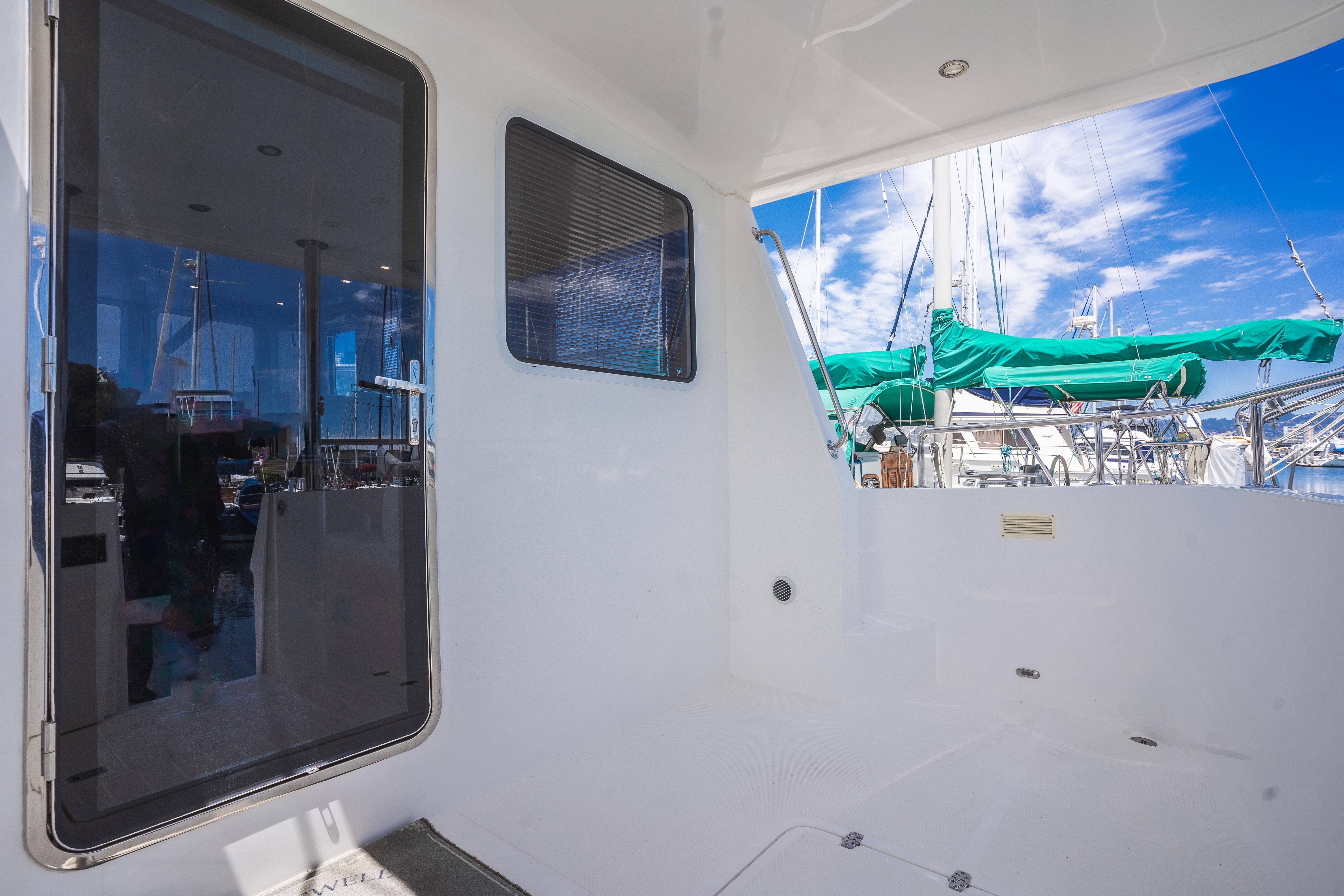 Spacious deck of 2025 Bracewell 41 yacht with marina view.