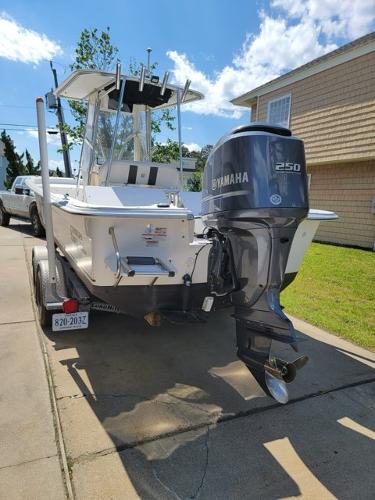 2011 Carolina Skiff 258 DLV boat with Yamaha 250 engine on trailer.