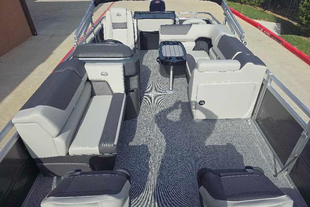 2026 Sun Tracker Fishin' Barge 20 DLX interior with spacious seating and modern design.