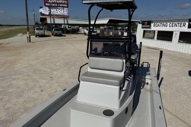 2025 Majek 24 Reaper boat at a dealership, featuring a sleek design and spacious seating.