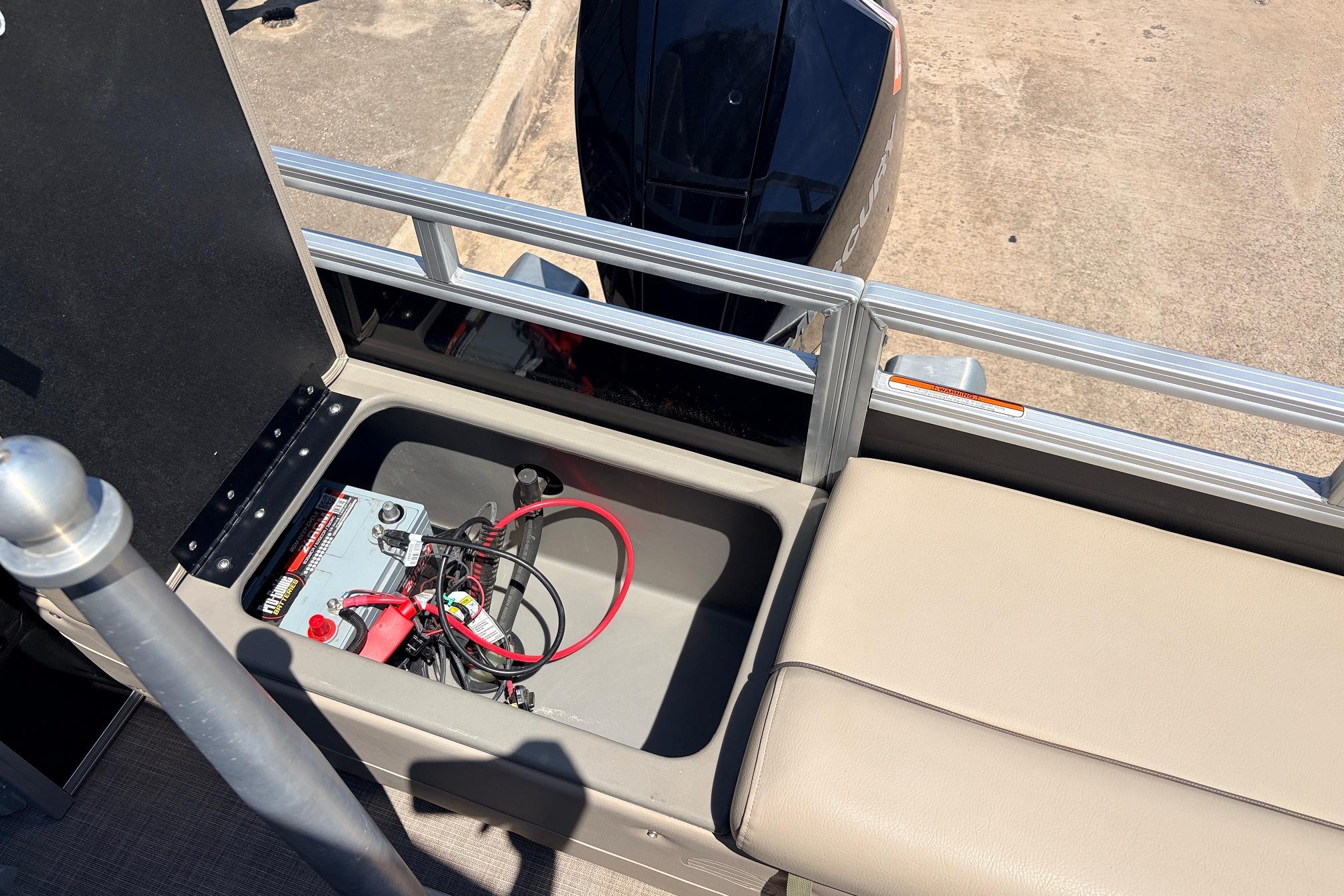2024 Sun Tracker SportFish 22 XP3 boat battery compartment with wiring and seating.