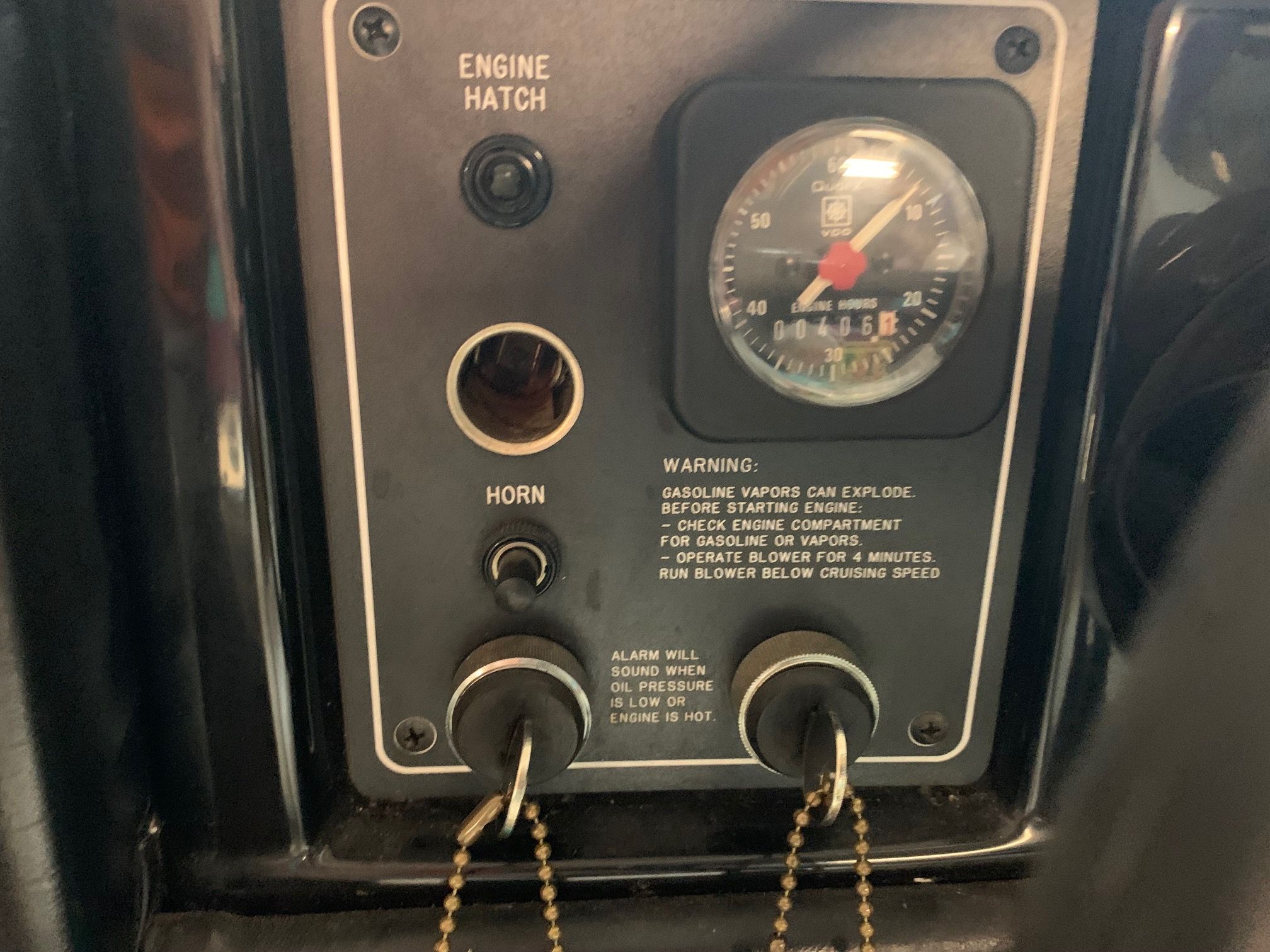 Dashboard with engine gauge and warning notices.