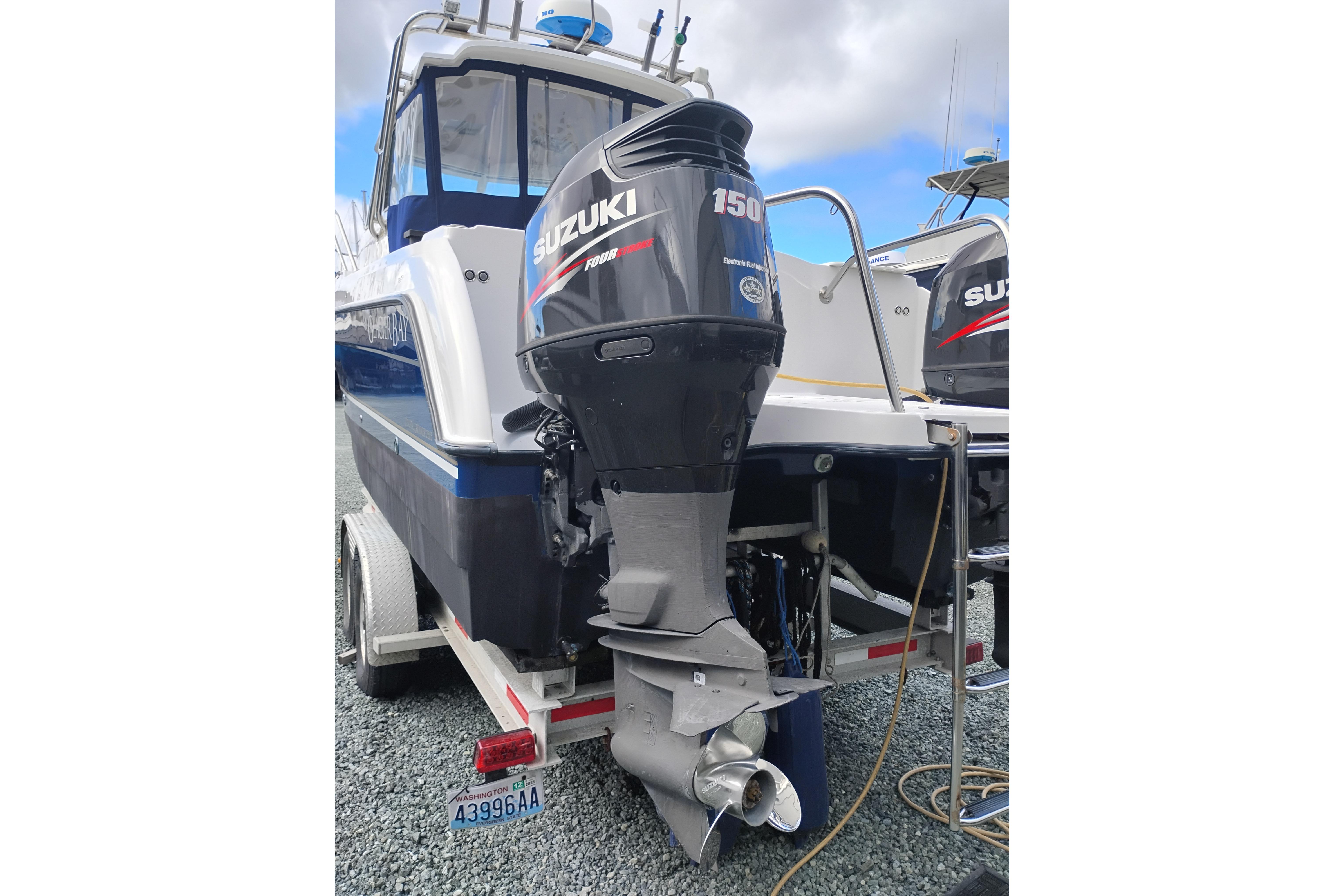 2007 Glacier Bay 2685 Coastal Runner with Suzuki 150 outboard motor on trailer.