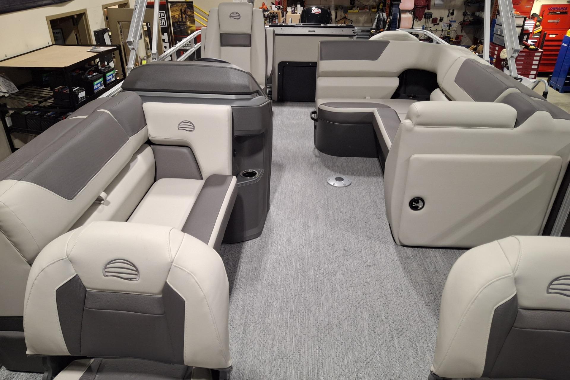 2026 Sun Tracker Party Barge 20 DLX interior with plush seating and modern design.