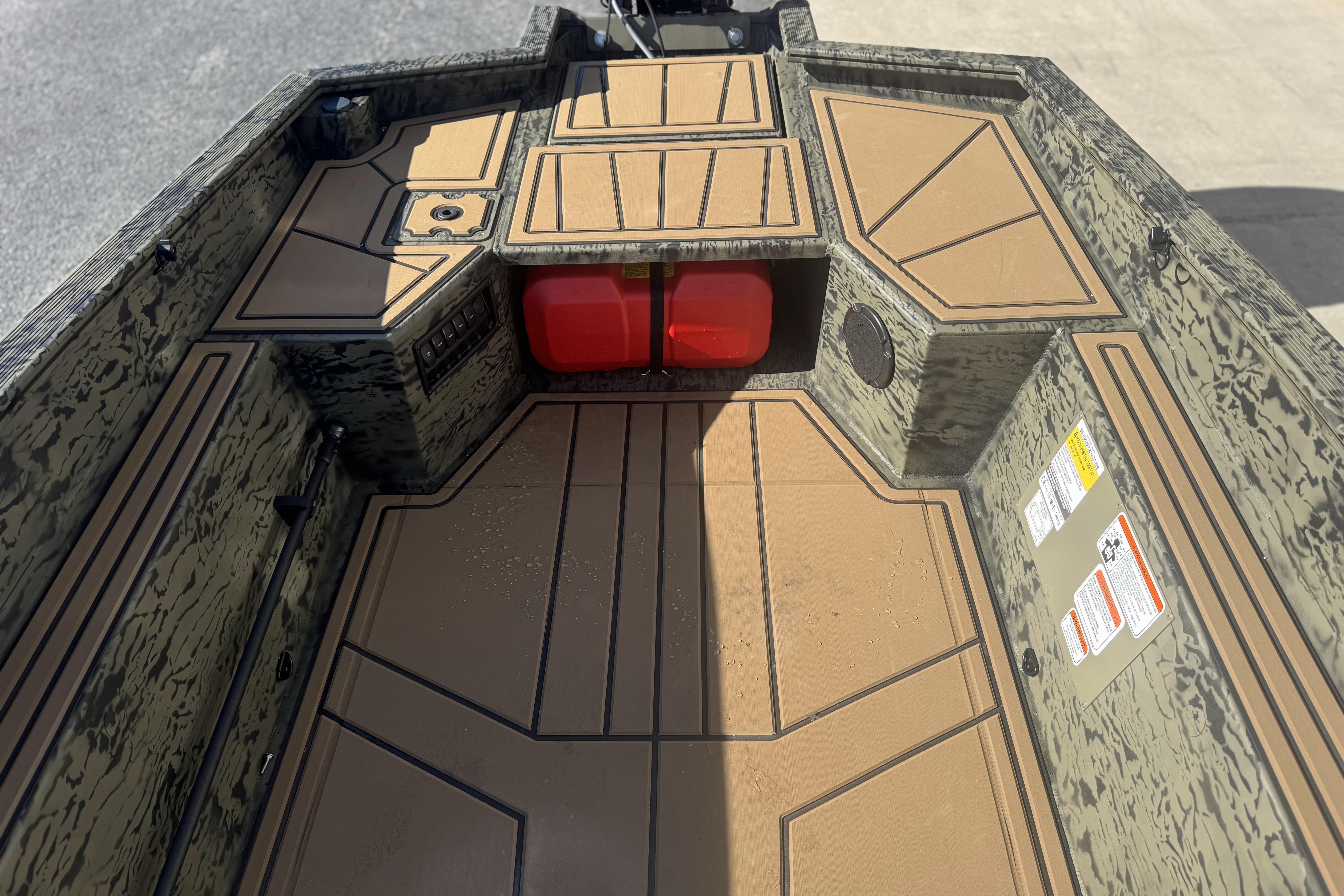 2026 Tracker Grizzly 1650 T Prairie Wings Edition boat interior with camouflage design.