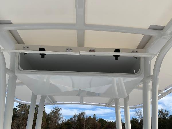 2024 Robalo R202 Explorer boat T-top with storage compartment.