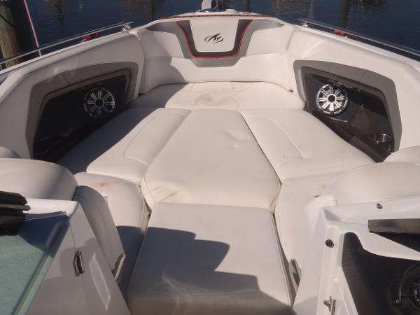 2015 Monterey 288 Super Sport boat interior with cushioned seating and speakers.