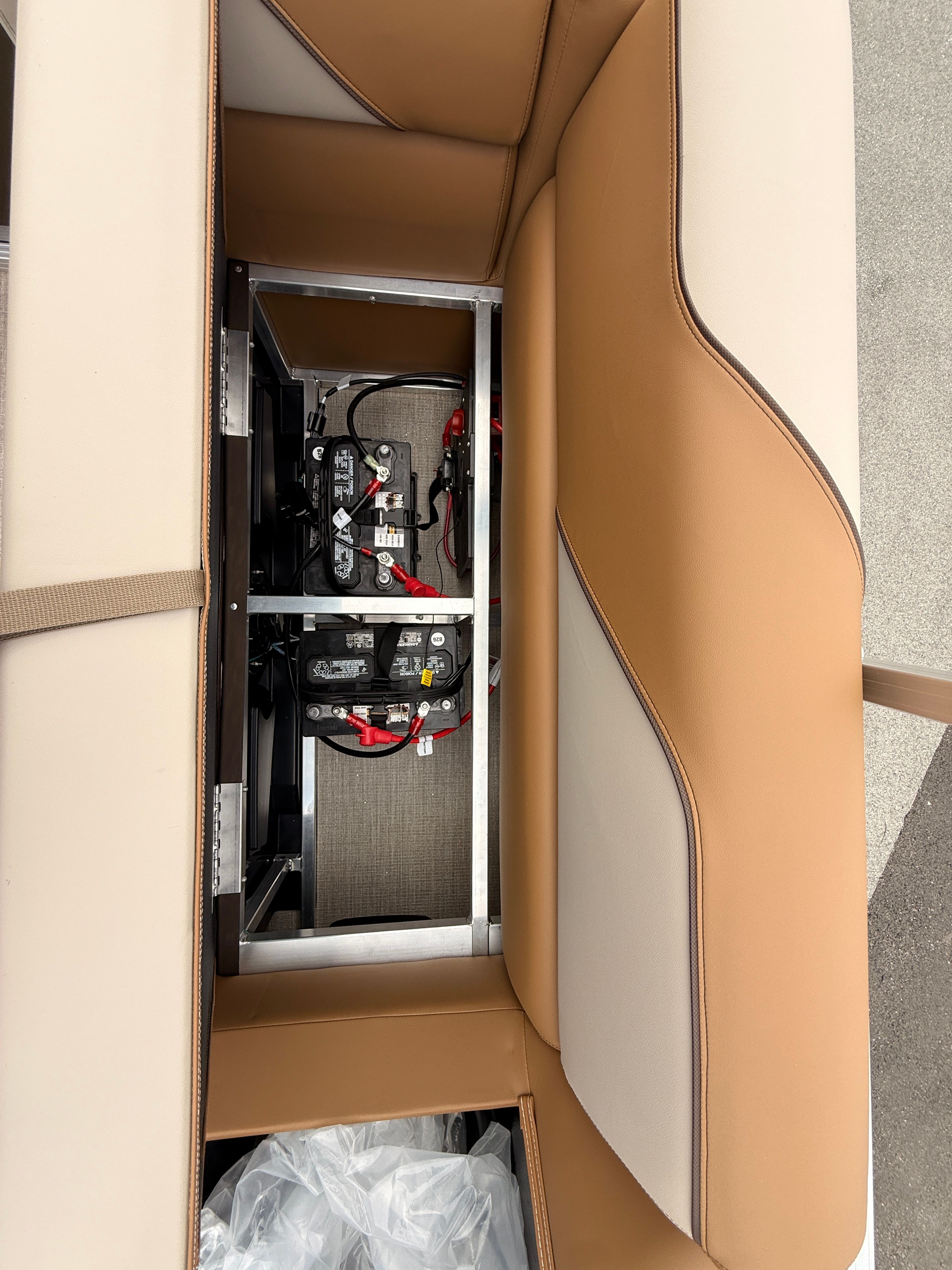 Battery compartment of 2026 Tahoe 2380 Sport Quad Lounger boat.
