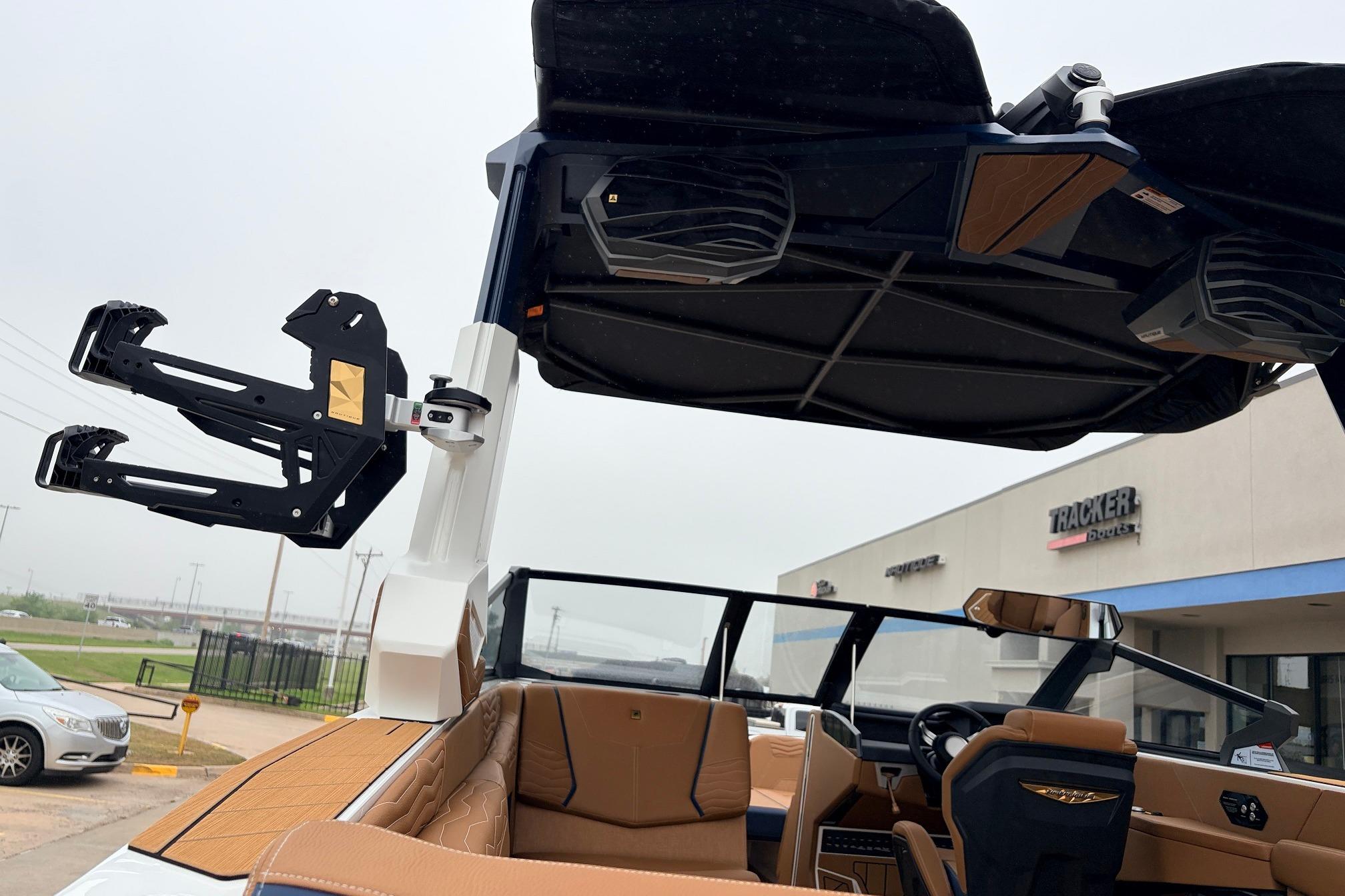 2026 Nautique Super Air Nautique G25 boat interior with advanced wakeboard rack and premium seating.