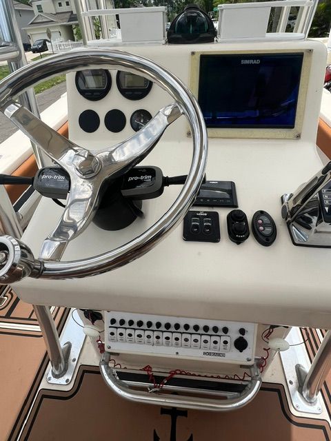 2007 Dorado 30 boat helm with Simrad display and controls.