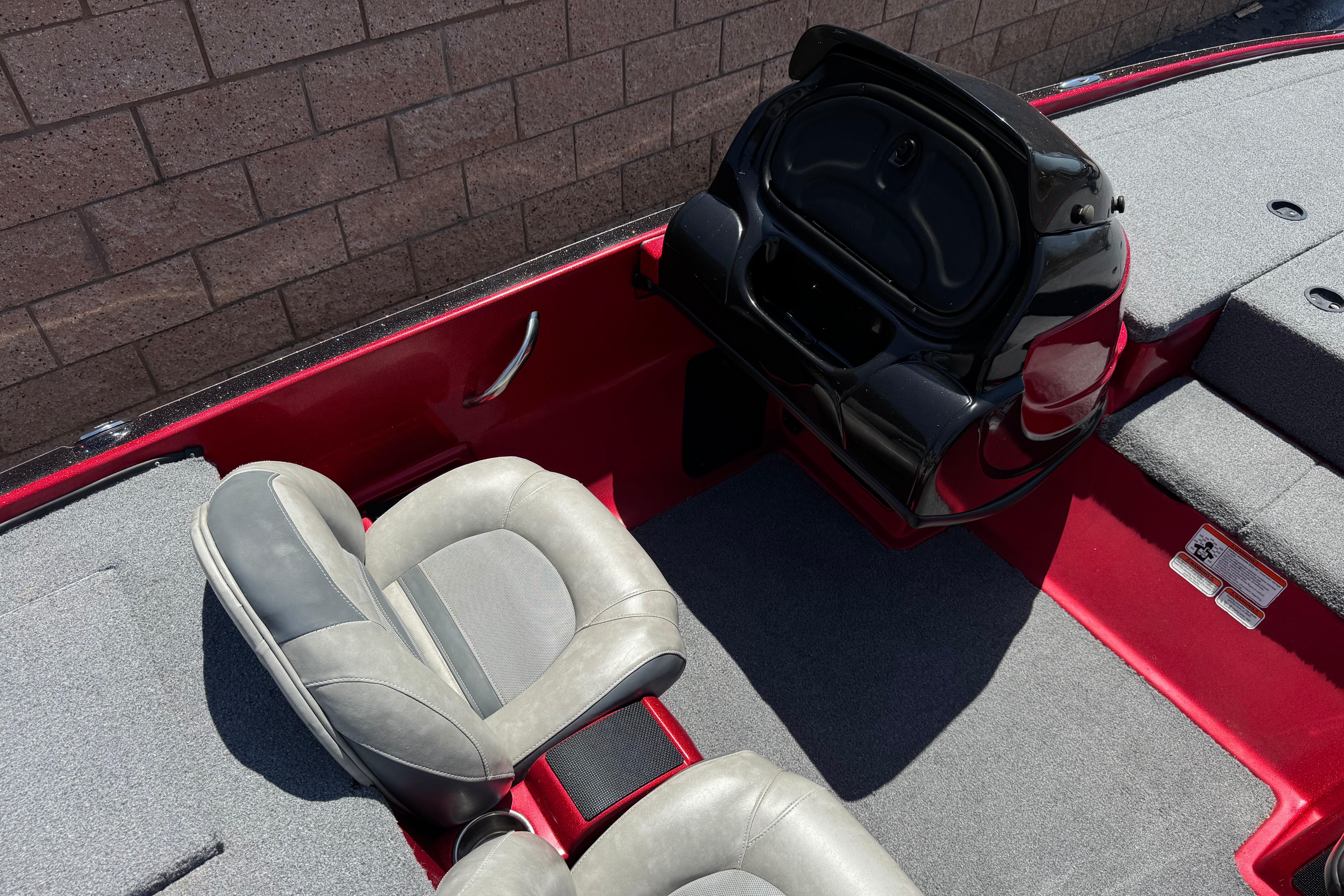 Interior of a 2012 Nitro Z-7 boat with gray seats and red accents.