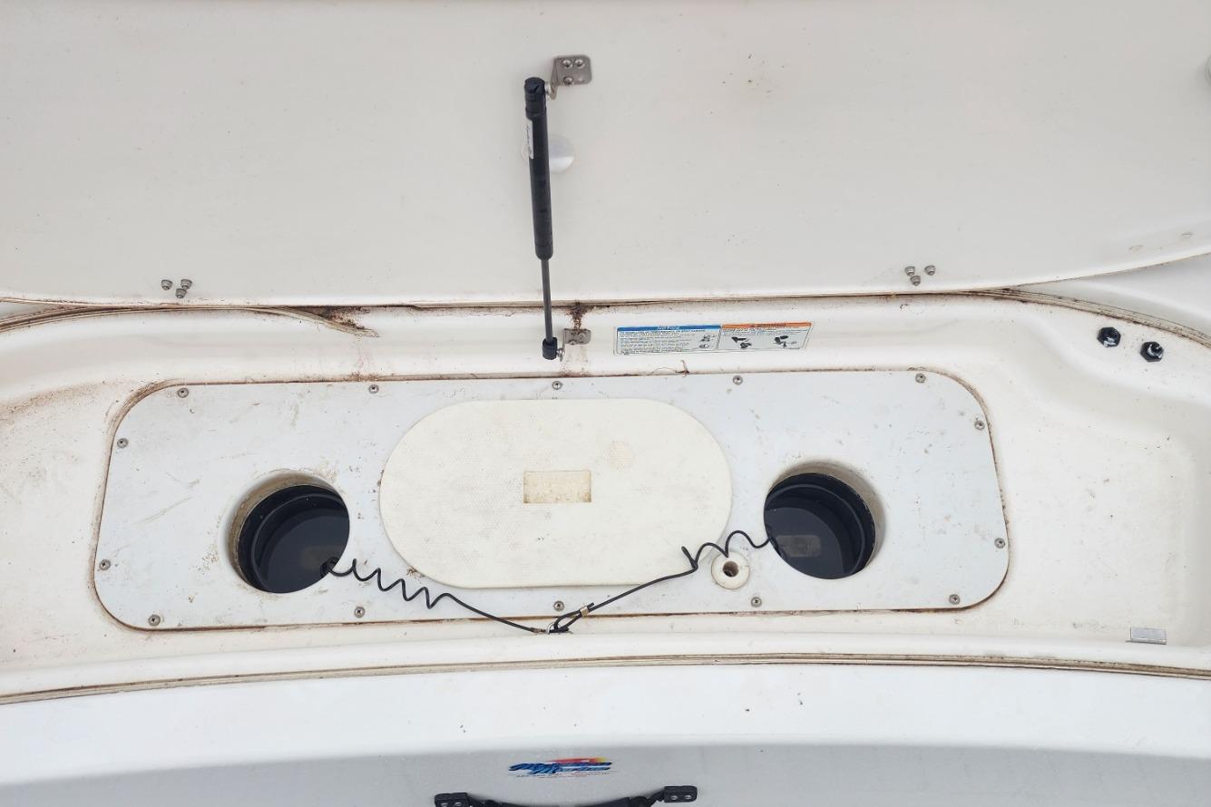 2015 Yamaha Boats 212X engine compartment with open hatch and visible components.