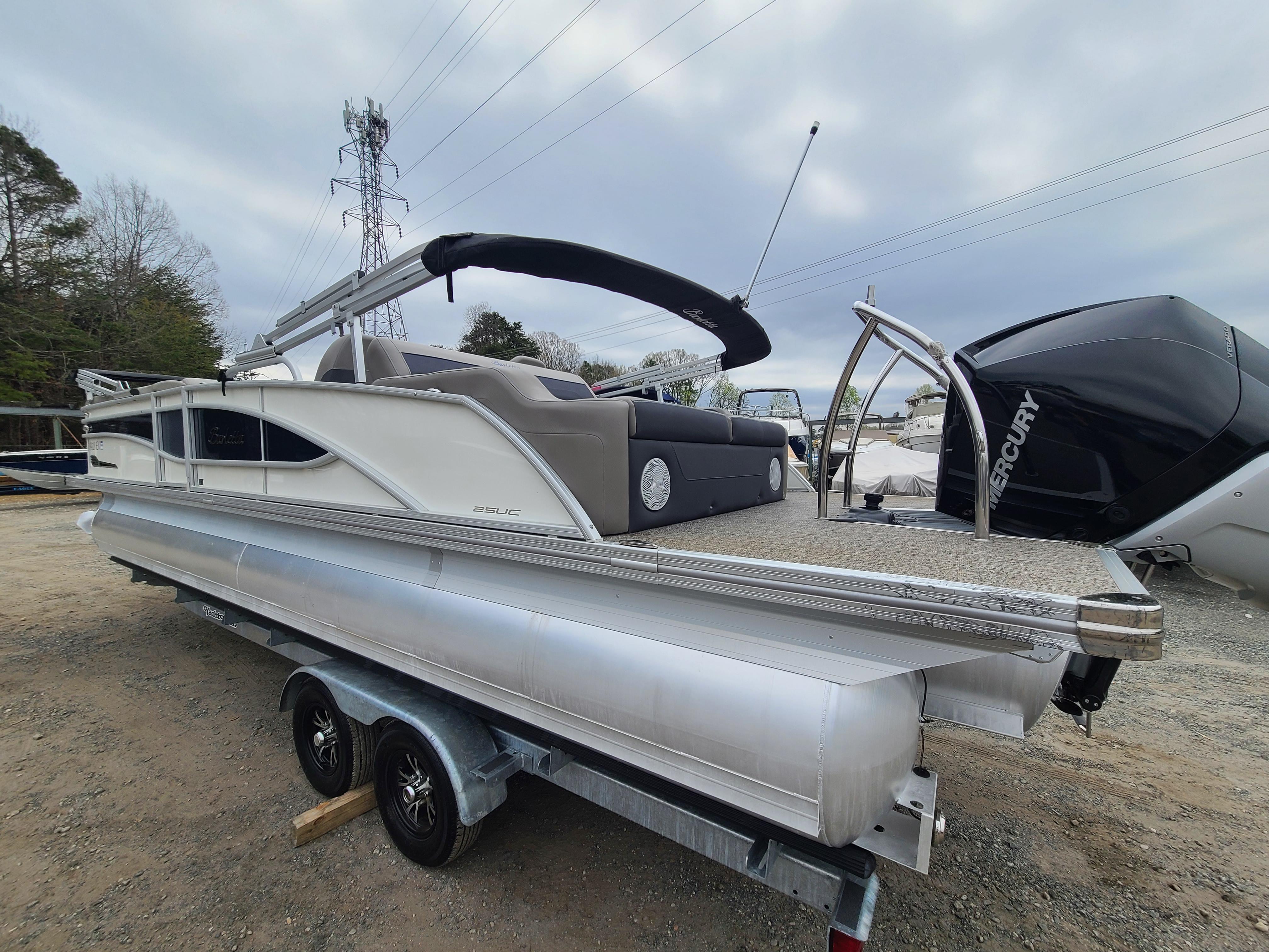 2022 Barletta CORSA 25UC pontoon boat on a trailer, side view.