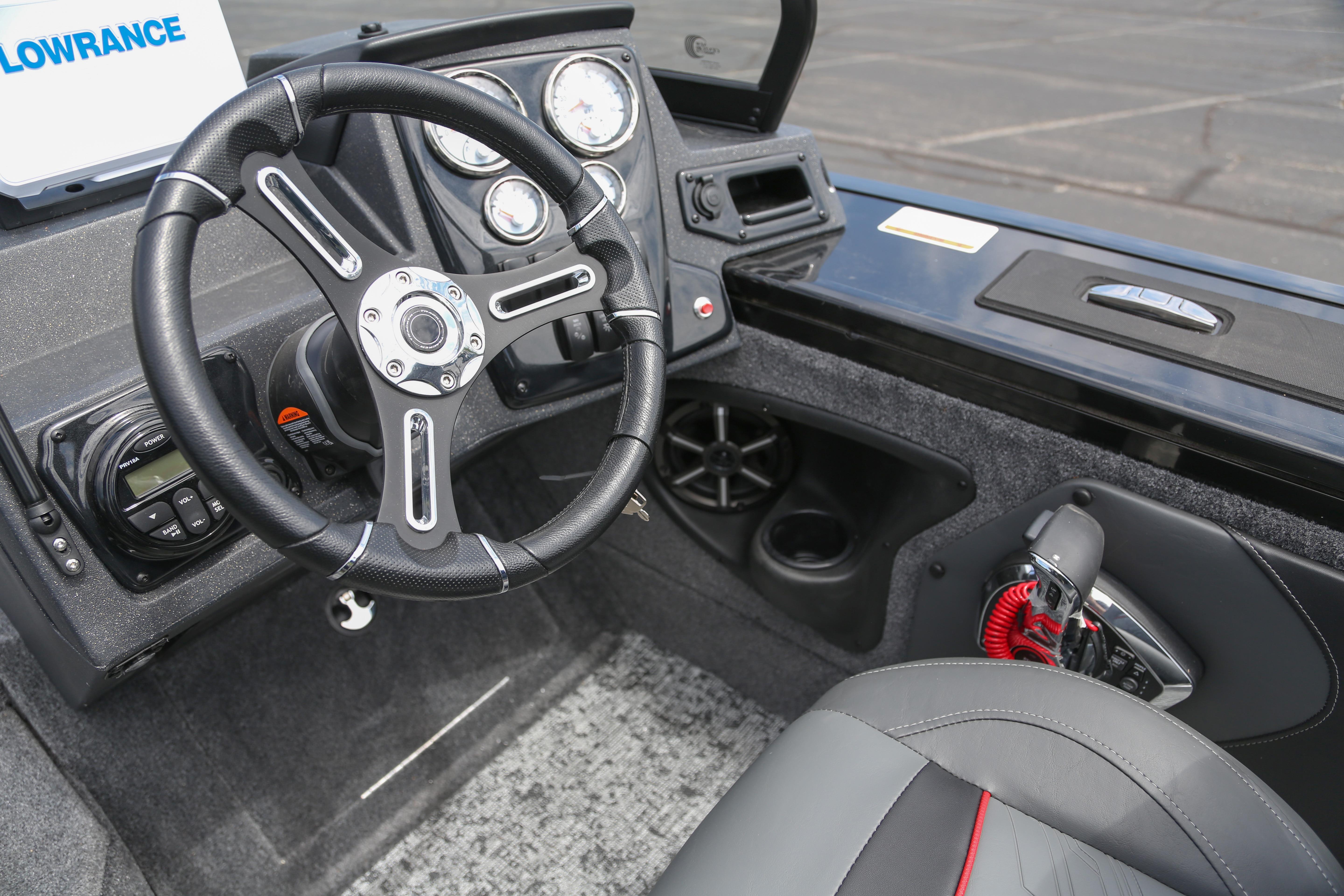 Interior of 2026 Tracker Targa V-19 WT boat with steering wheel and control panel.