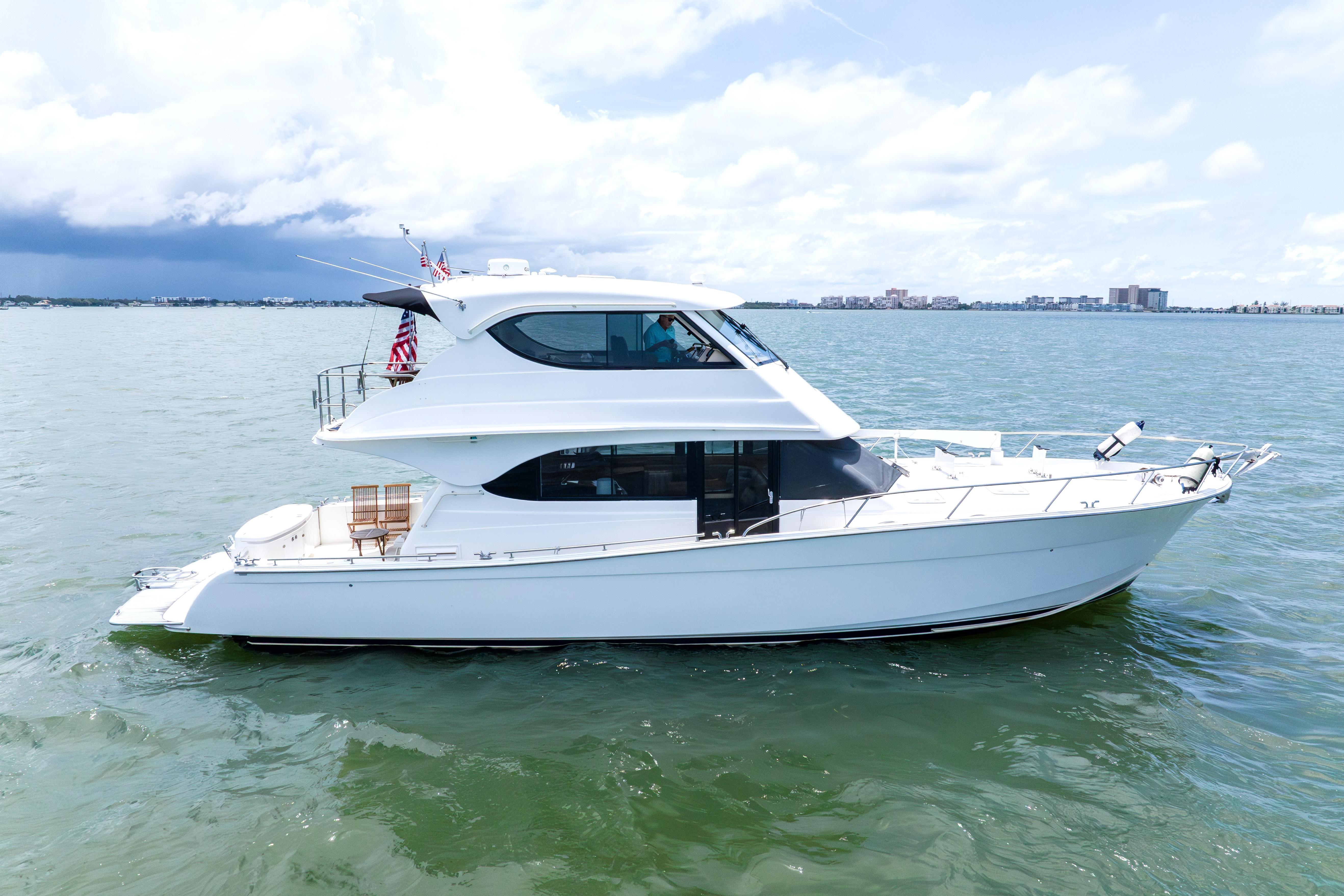 2008 Maritimo 52 yacht cruising on calm waters under a partly cloudy sky.