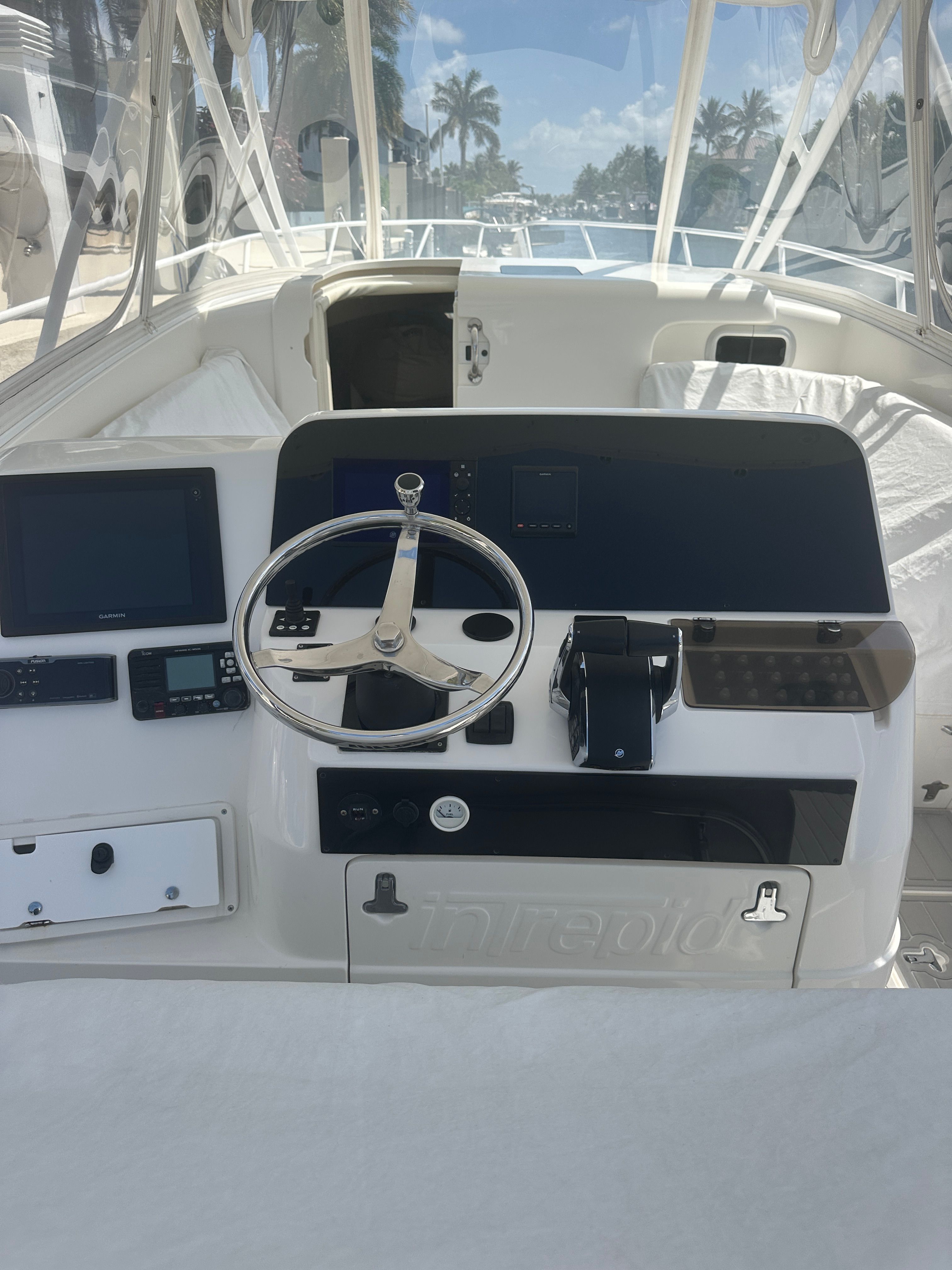 2004 Intrepid 377 Walkaround helm with modern electronics.