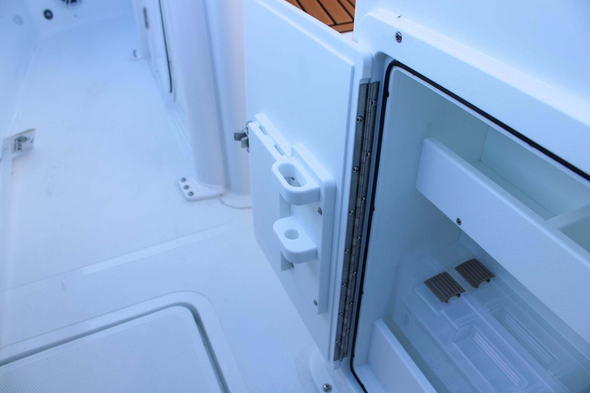2026 Sea Hunt Gamefish 25 boat interior with open storage compartment.