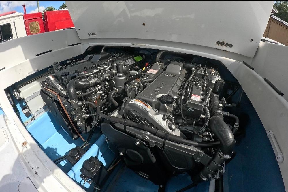 Engine compartment of a 2018 Catamaran Coaches 38 Lightning boat, showcasing dual engines.